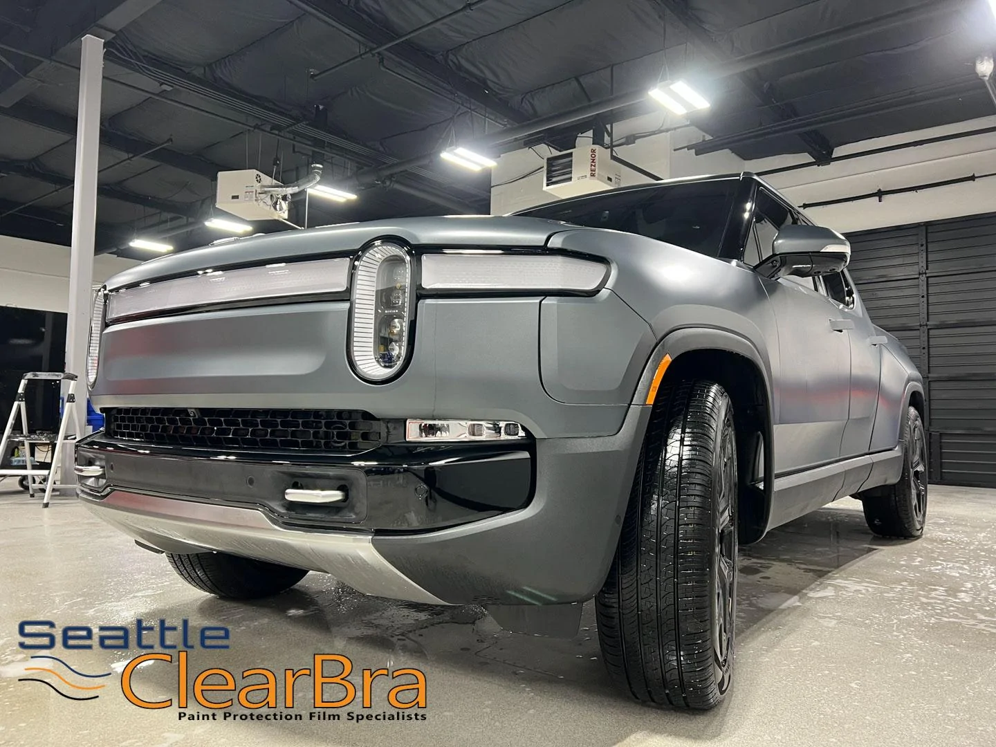Rivian R1T R1S Elevate Your Rivian in the Pacific Northwest with XPEL Stealth and Ceramic Coating seattle-clearbra-rivian-r1t-xpel-ultimate-plus-fusion-stealth-redmond-clear-bra-ppf-paint-pro