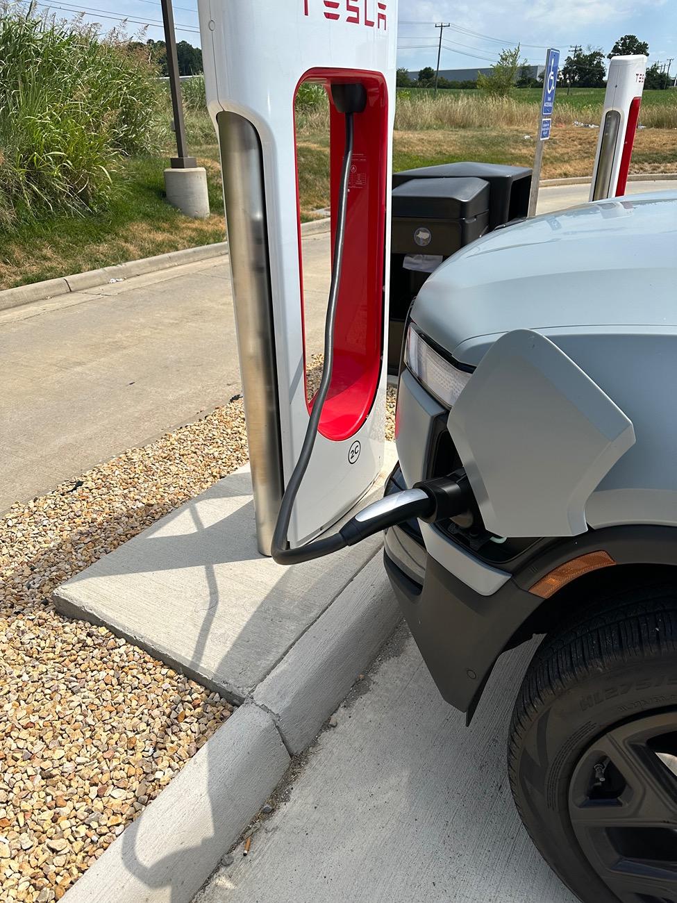 Rivian R1T R1S Wider Tesla SC stall parking, longer cable or ? IMG_3183