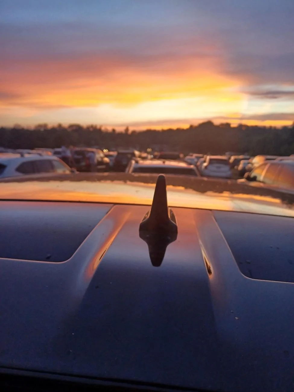 Rivian R1T R1S BestEvMod 4TH OF JULY RAFFLE looking over the roof of our Rivian at sunset at the 4th of July fireworks