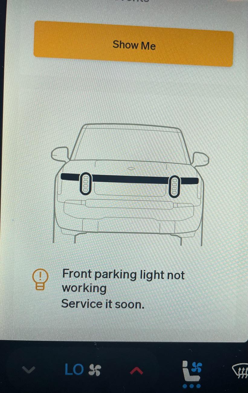 Rivian R1T R1S Received Front parking lights not working. Service it soon. IMG_5943