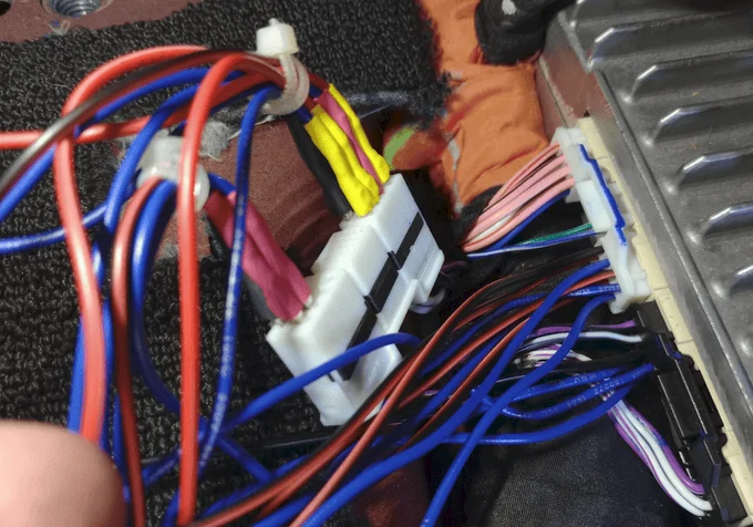 Rivian R1T R1S Teardown: R1S Audio Unit under drivers seat and speaker harness pinnout. 1721739922116-hu