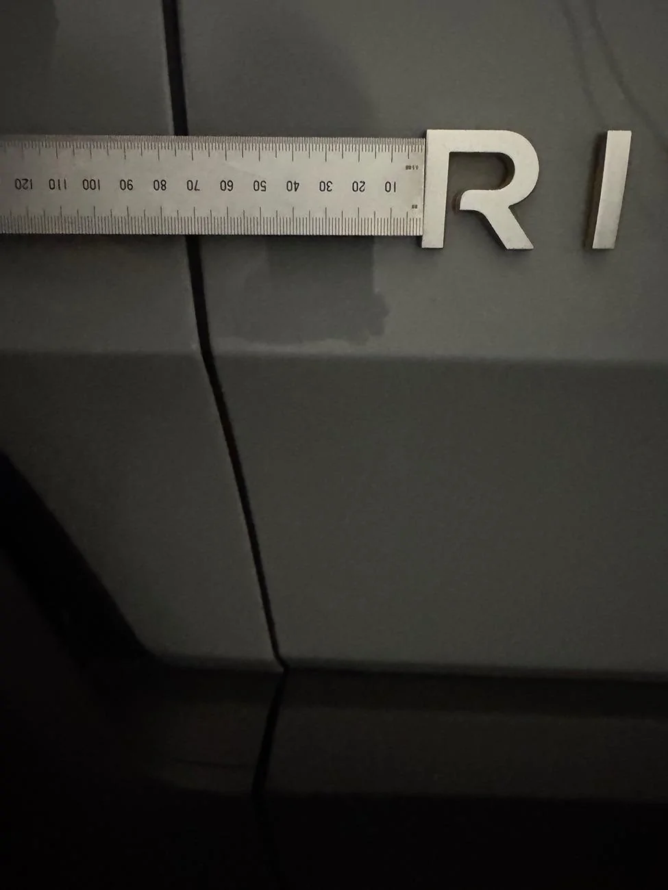 Rivian R1T R1S Abstract Ocean Rivian Emblem - Spacing? IMG_0610