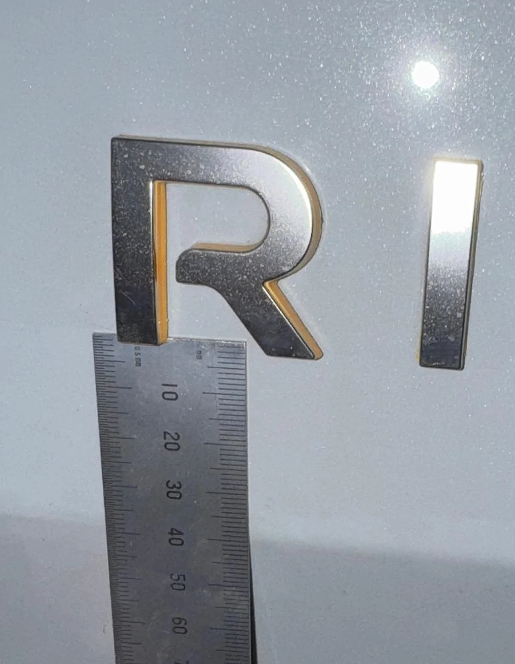 Rivian R1T R1S Abstract Ocean Rivian Emblem - Spacing? IMG_0608