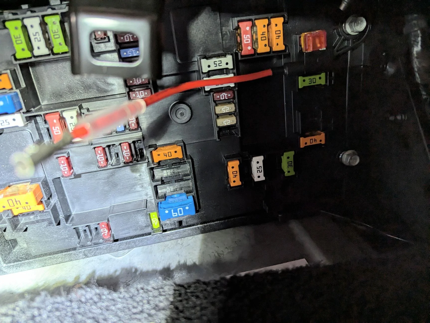 Rivian R1T R1S Interior passenger-side fuse box PXL_20240817_162249304~2