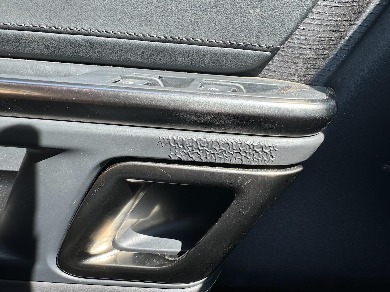 Rivian R1T R1S Peeling next to driver side indoor hand pull IMG_5335
