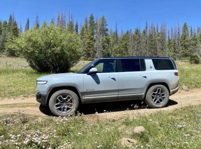 Rivian R1T R1S Longest-Range Rivian R1S Versus Tesla Model X AWD -- North American Specifications Comparison R1S on Dirt Road
