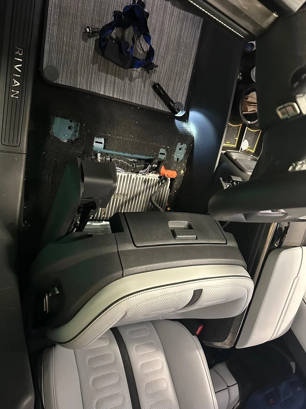 Rivian R1T R1S Earbuds lost under seats in R1T IMG_8209
