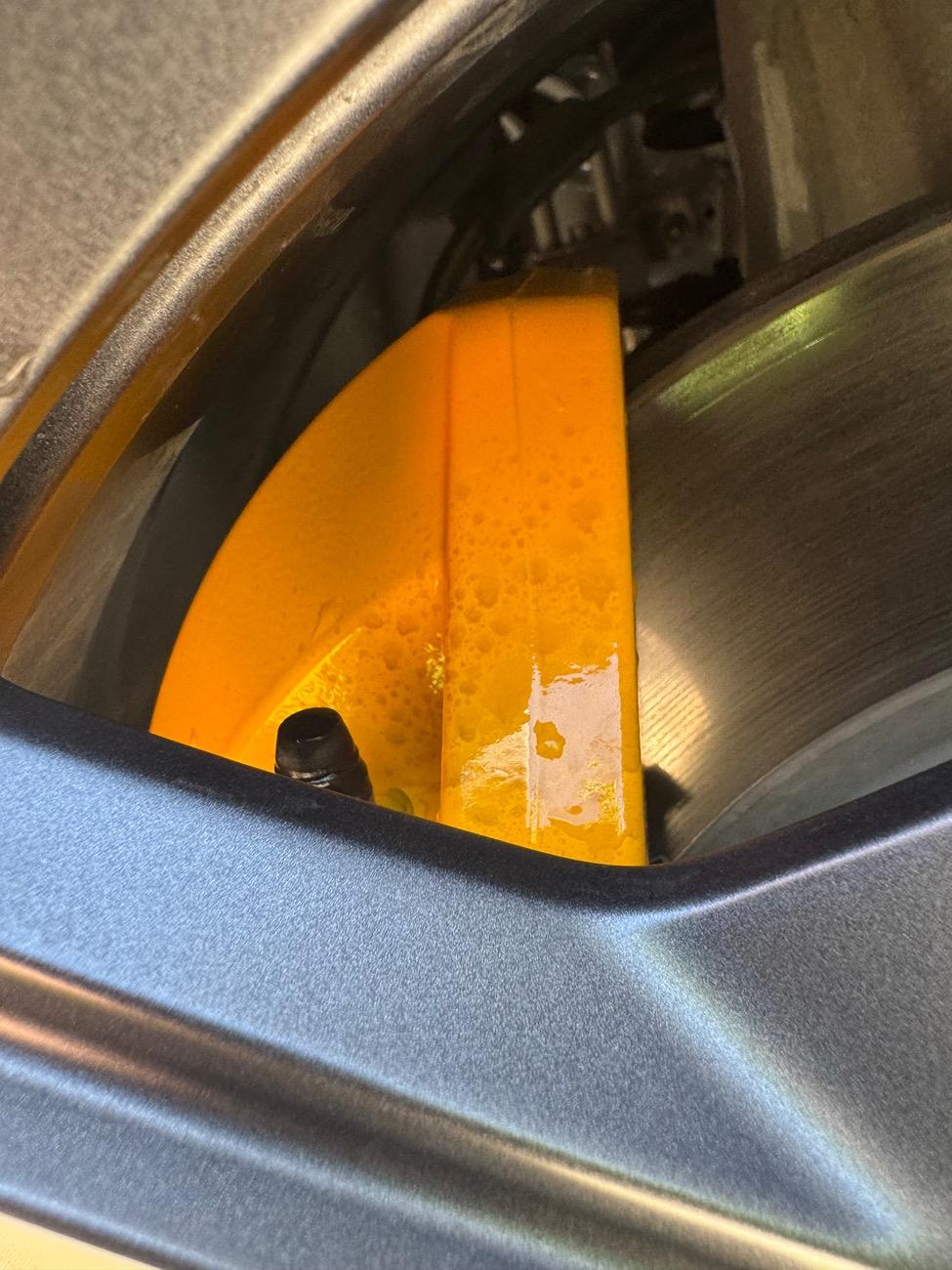 Rivian R1T R1S Dark staining on yellow calippers IMG_2391