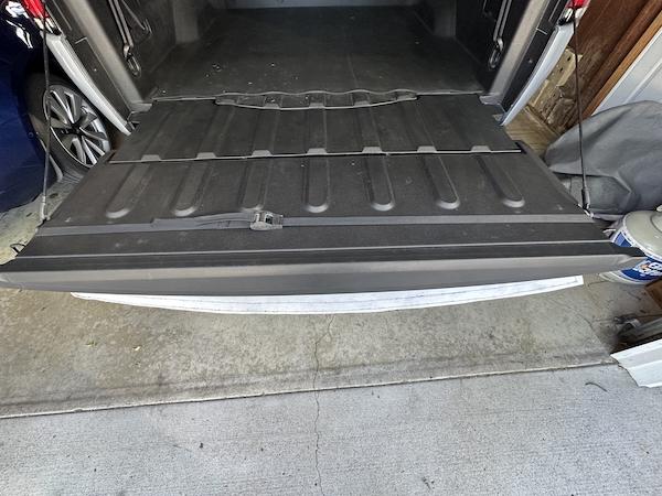 Rivian R1T R1S Flated Air-Topper modifications for R1T Strap in postion on tailgat