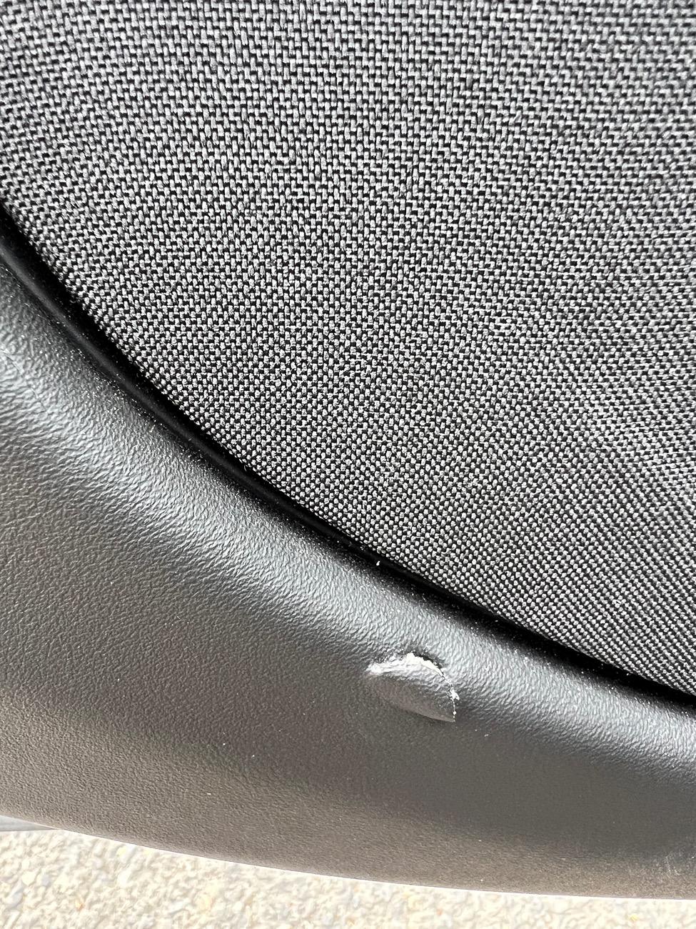 Rivian R1T R1S Little rip in door leather IMG_2583