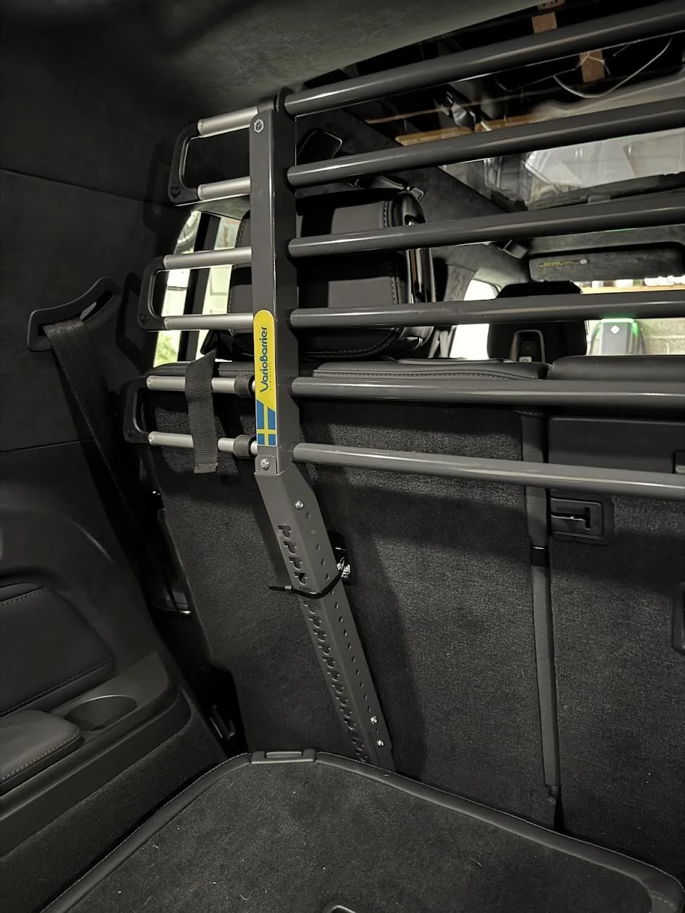 Rivian R1T R1S Anyone using the third-row (R1S) for dog transport expensive-r1s-dog-barrier-v0-h6fb8vkirkwd1