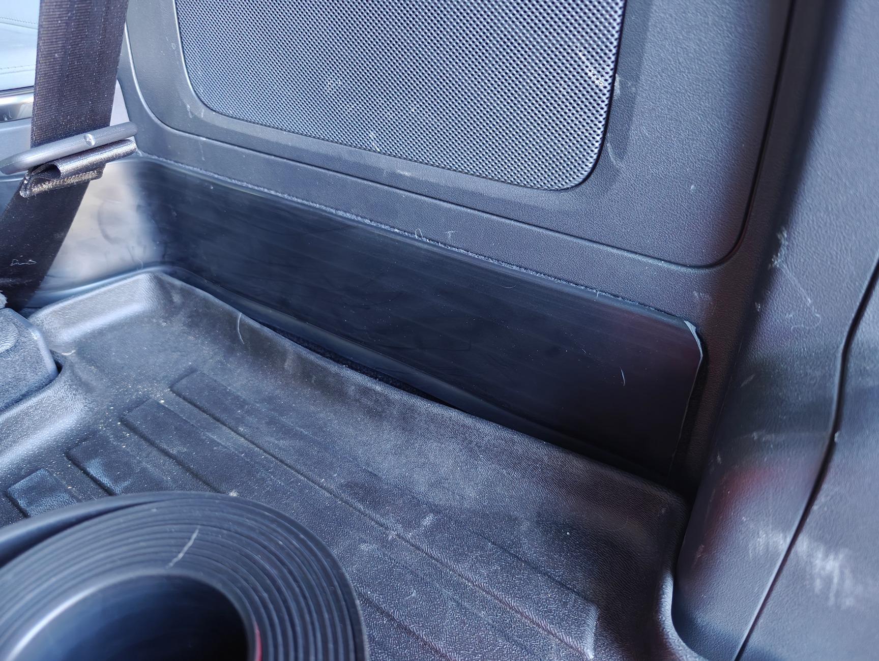 Rivian R1T R1S Simple mod to protect lower side carpet in rear cargo area R1S 1000011678