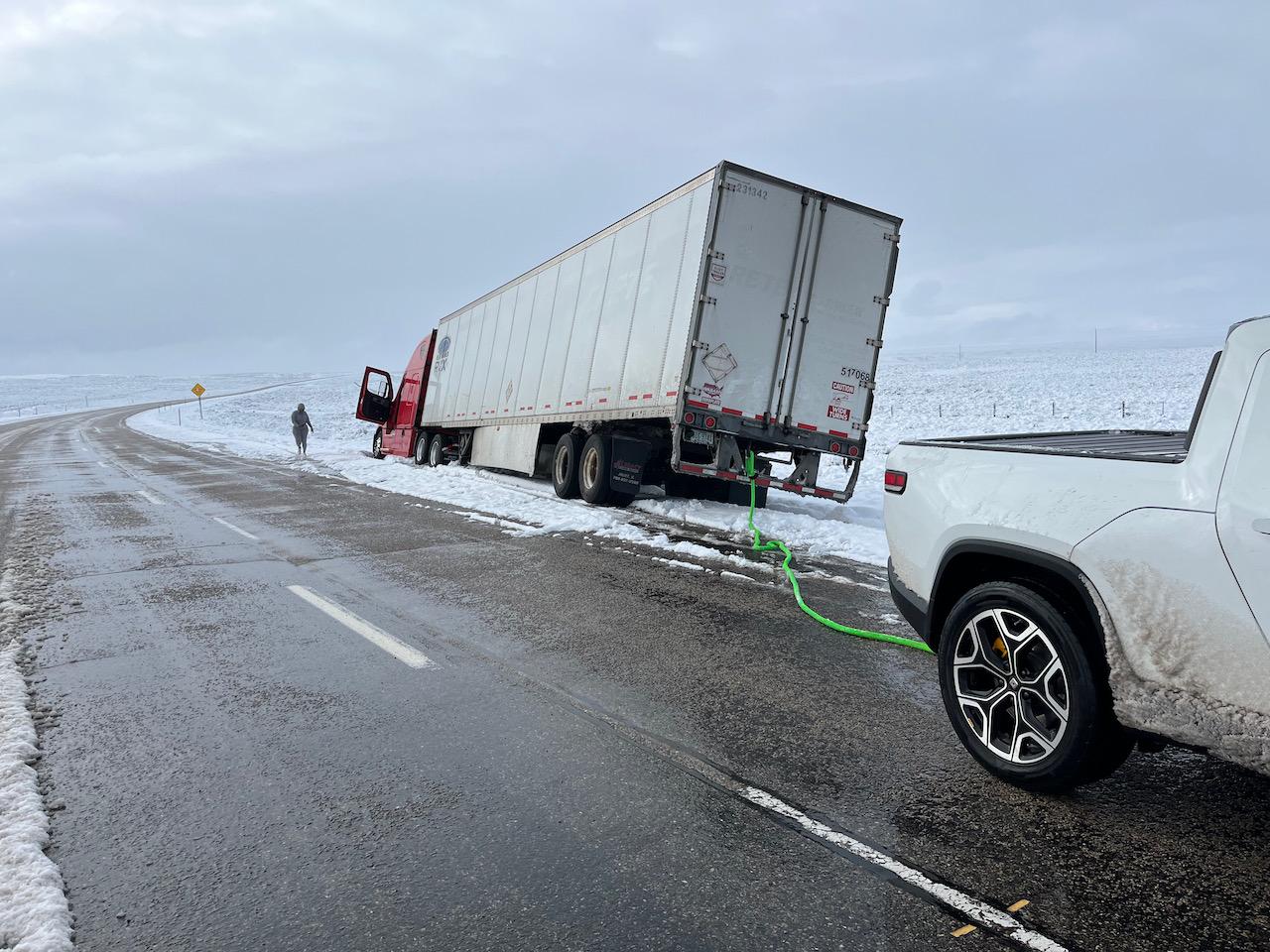 Rivian R1T R1S Rivian R1T saves a stuck semi by pulling it out of mud in Covington, KY Wyoming - 1