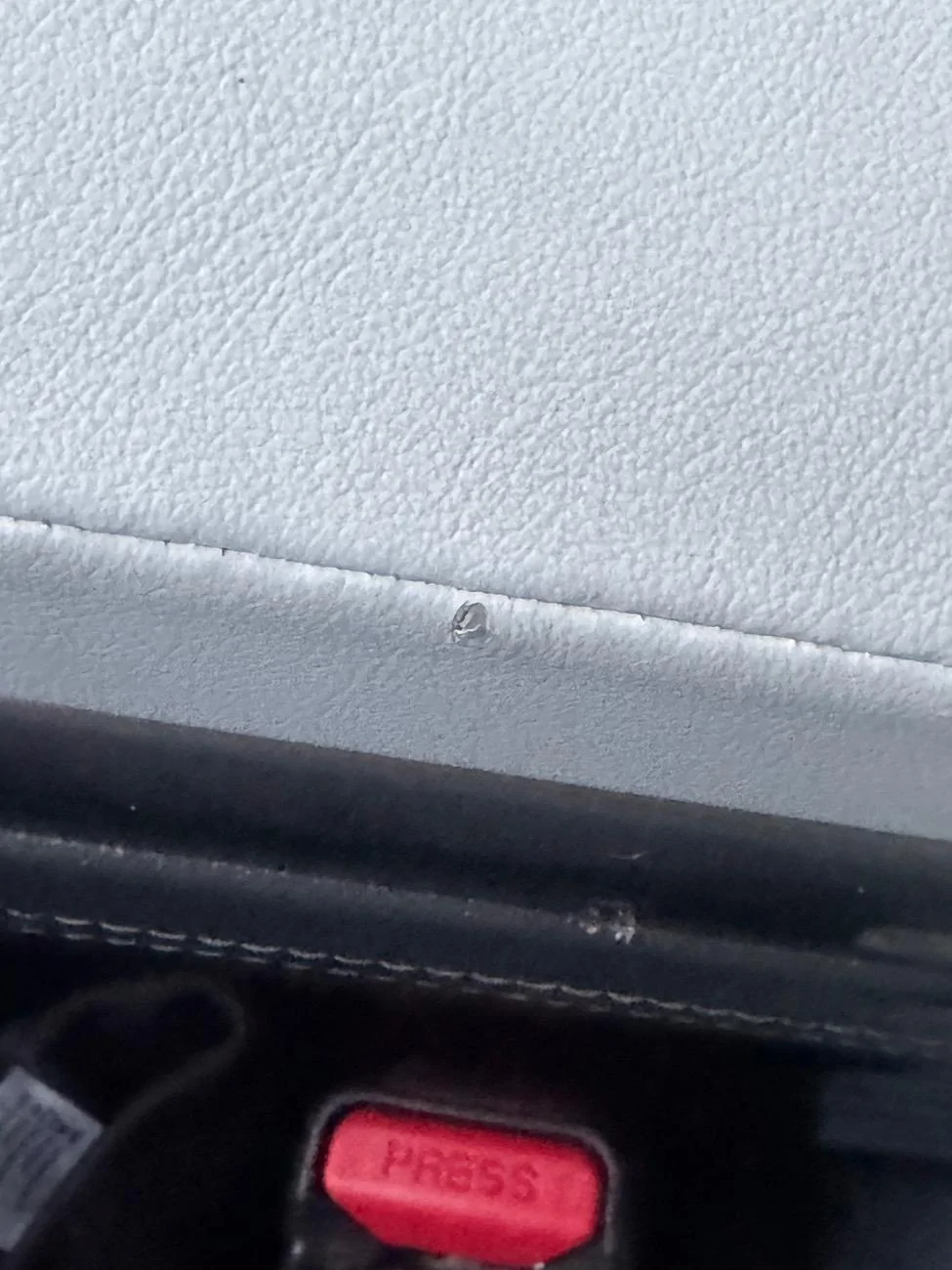 Rivian R1T R1S Tiny Tear in hand rest/mid compartment IMG_6395