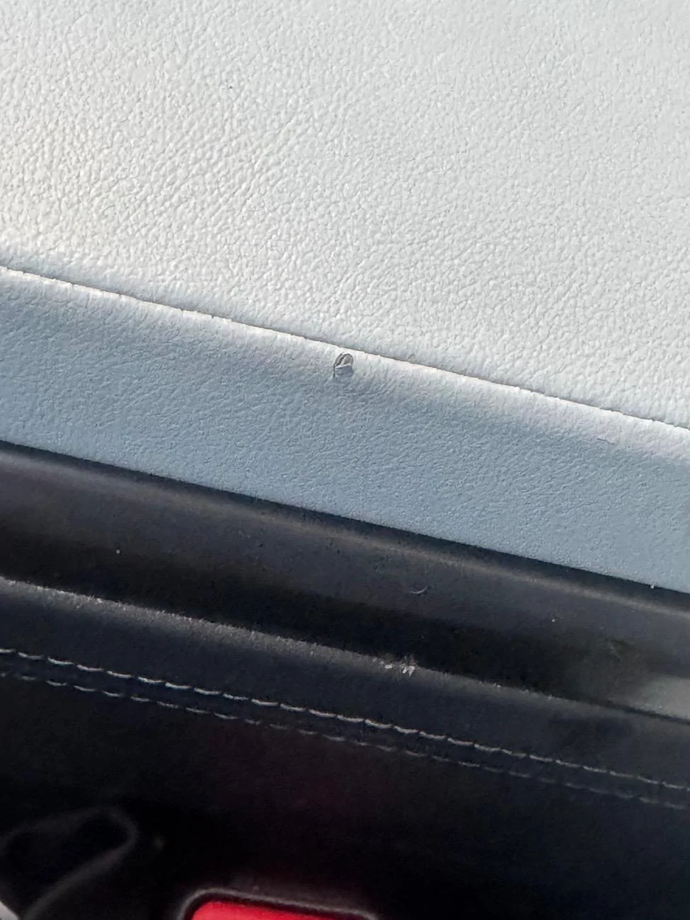 Rivian R1T R1S Tiny Tear in hand rest/mid compartment IMG_6394