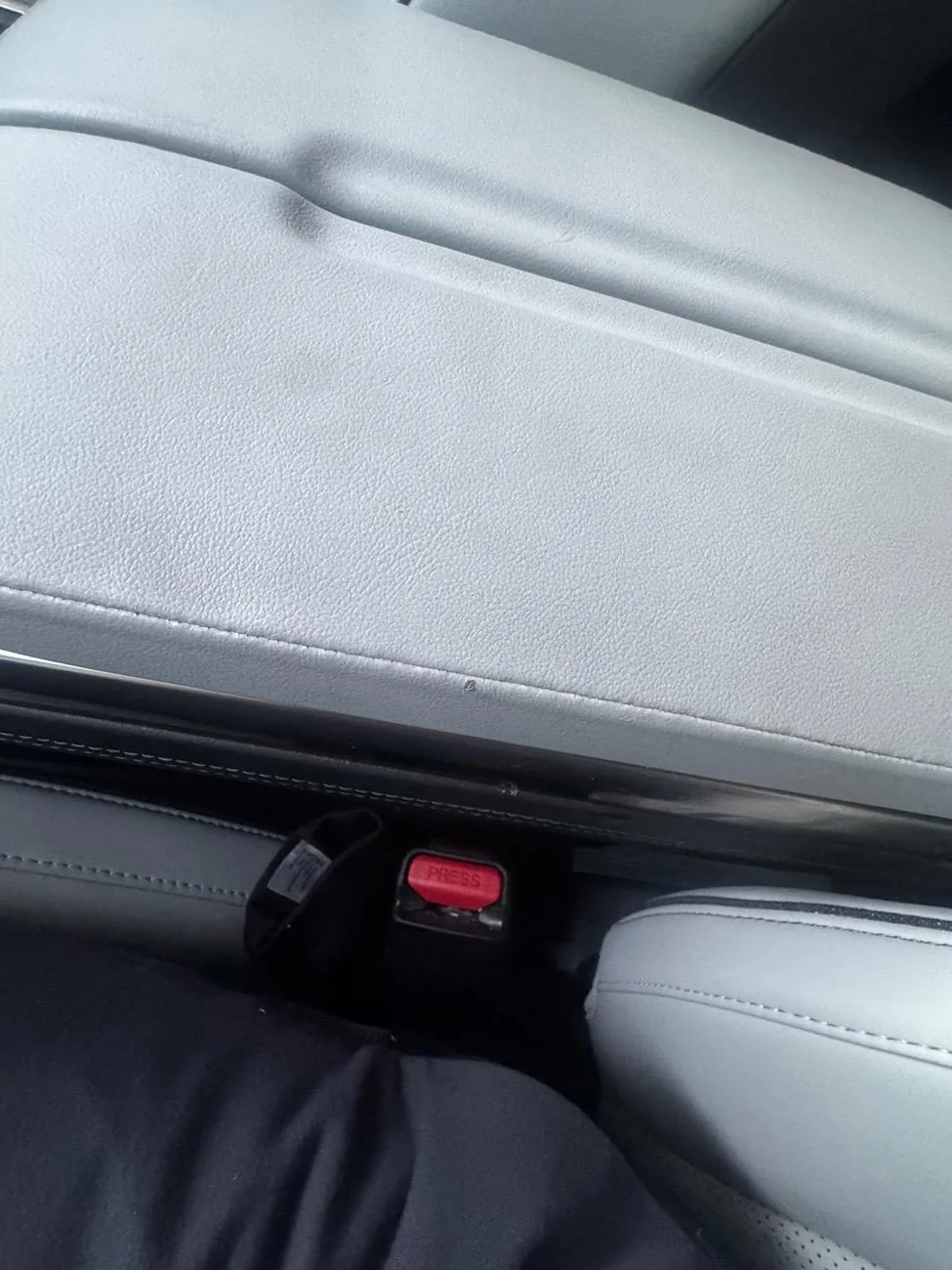 Rivian R1T R1S Tiny Tear in hand rest/mid compartment IMG_6396