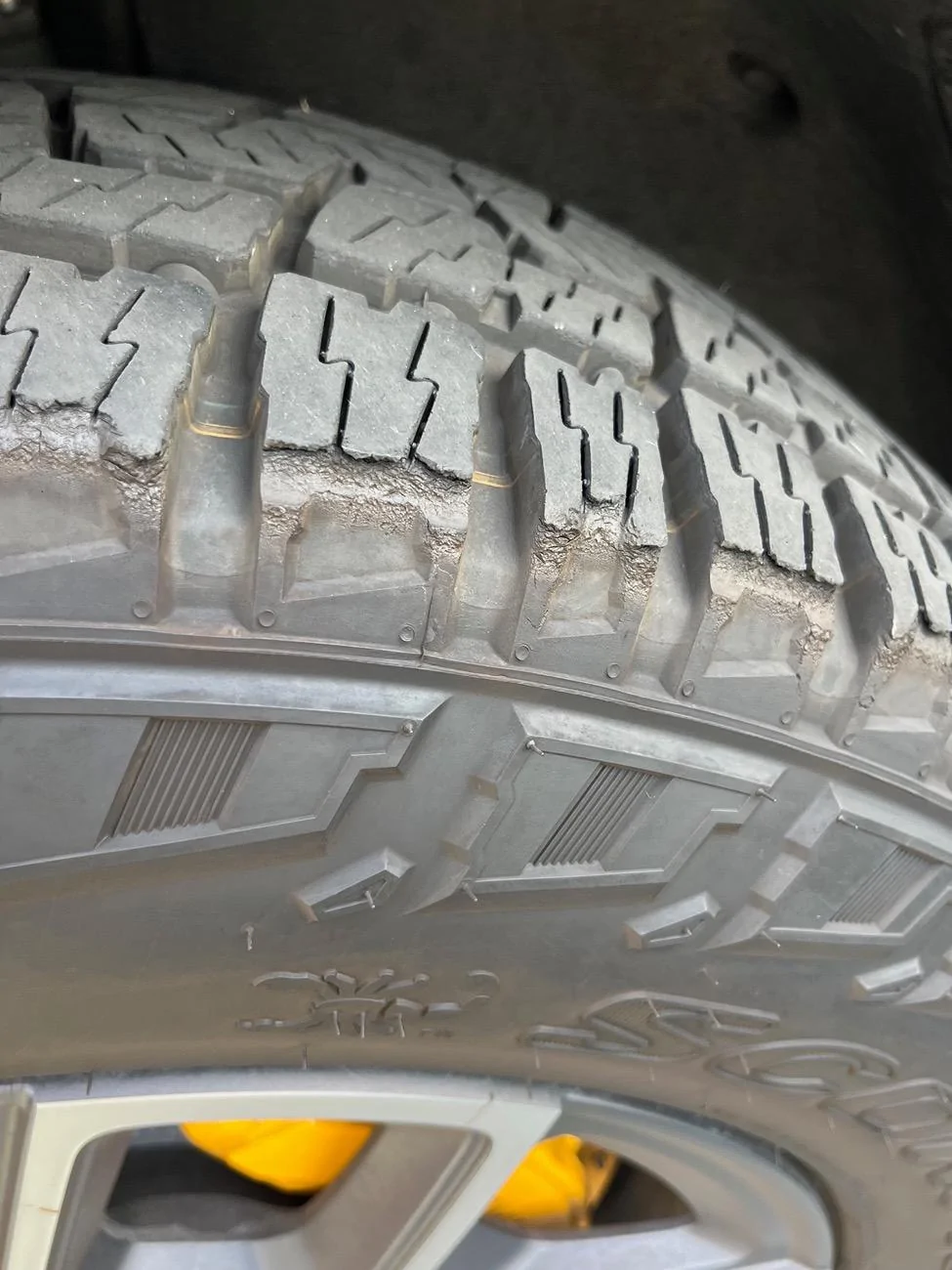 Rivian R1T R1S Outside AT tires exhibiting tread blocks chunking off 858106F9-349E-48AA-996E-2646B8B57EC5