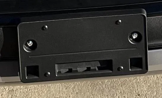 Rivian R1T R1S Where does the front license plate get mounted? 583E4C6D-4F86-4EA5-9884-86112CF8F2BD