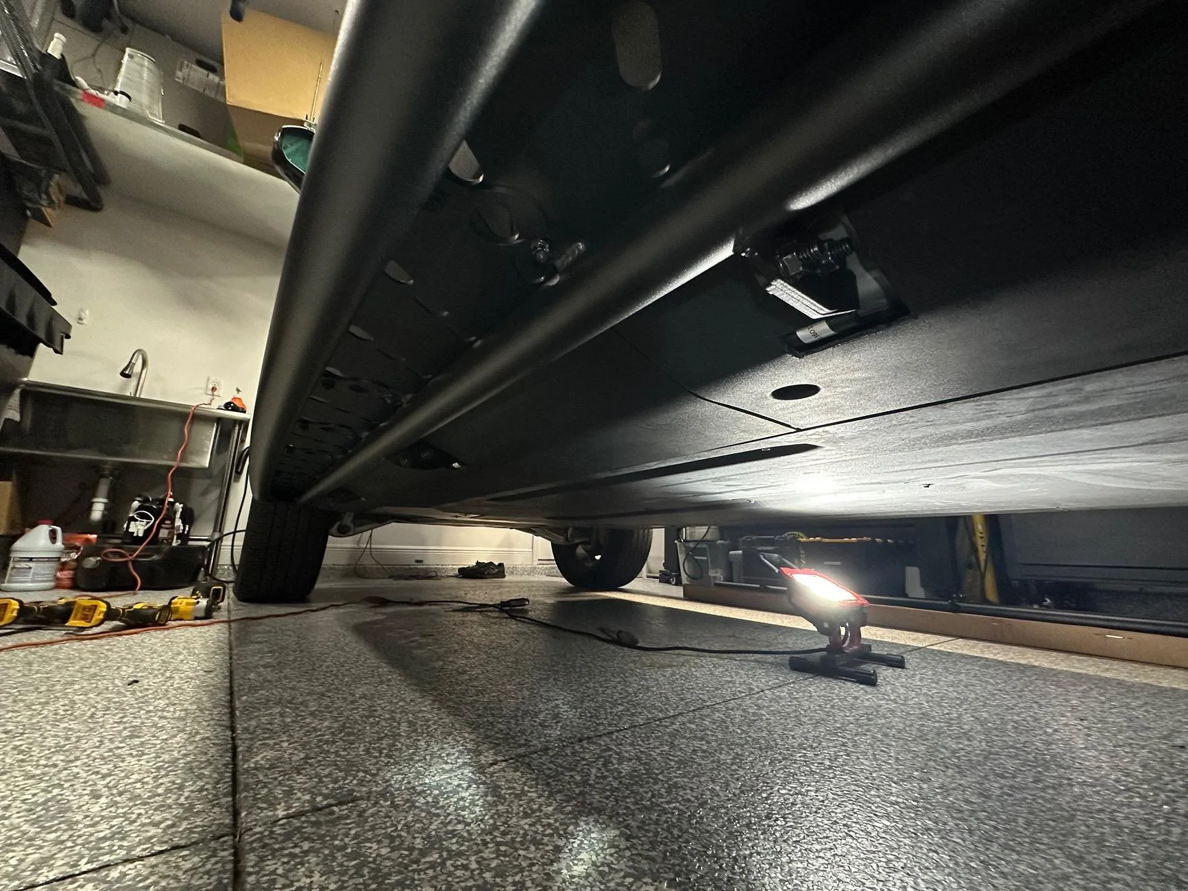 Rivian R1T R1S Rivian R1S Running Board Install - Help me understand plastic hole cutting IMG_1572