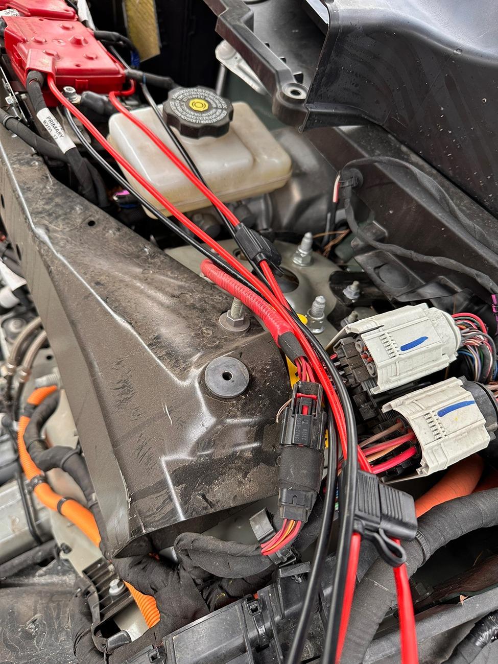 Rivian R1T R1S Installed frunk wired solar-capable 12v battery tender to reduce vampire drain IMG_4212