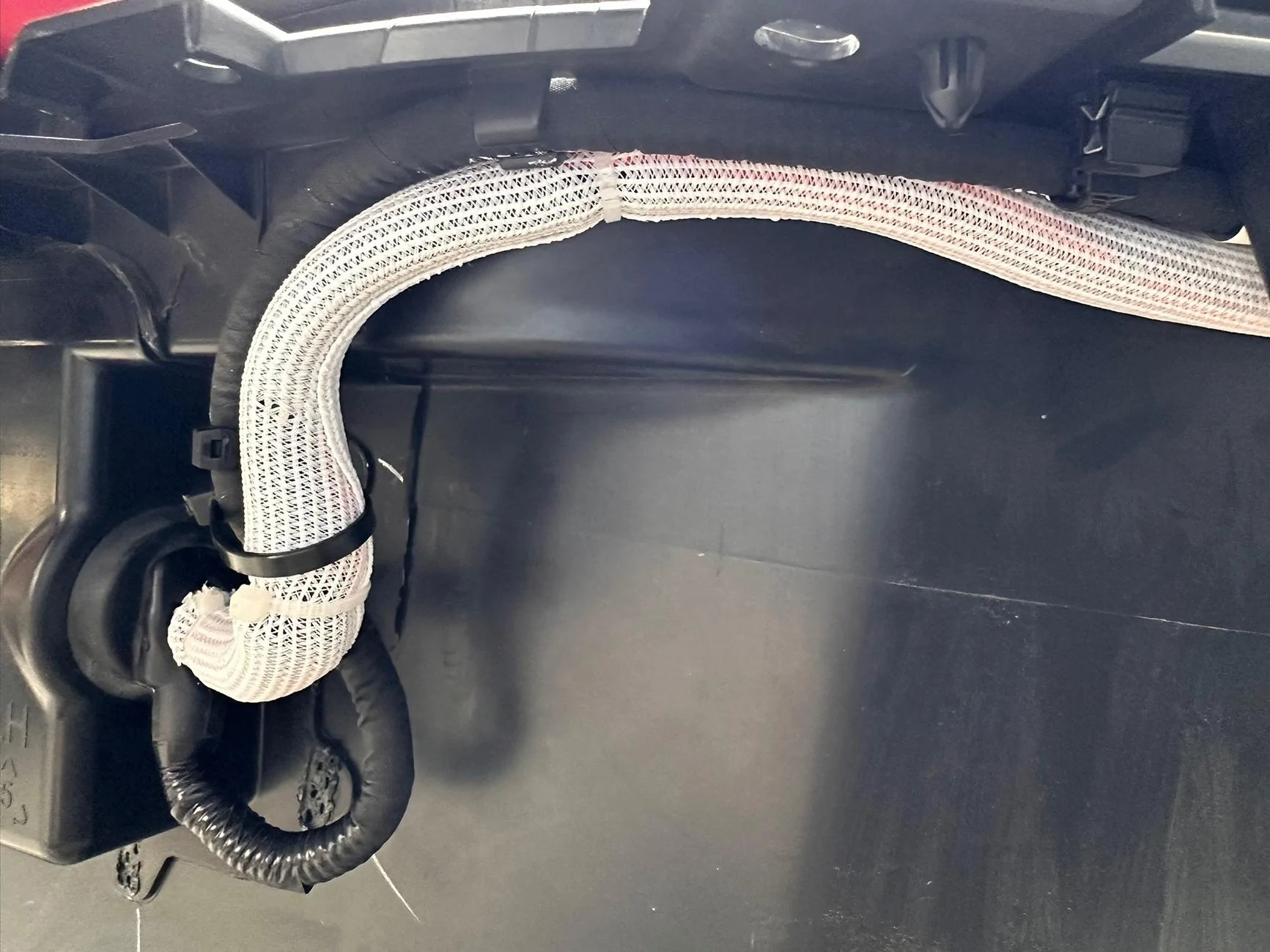 Rivian R1T R1S Installed frunk wired solar-capable 12v battery tender to reduce vampire drain IMG_4215