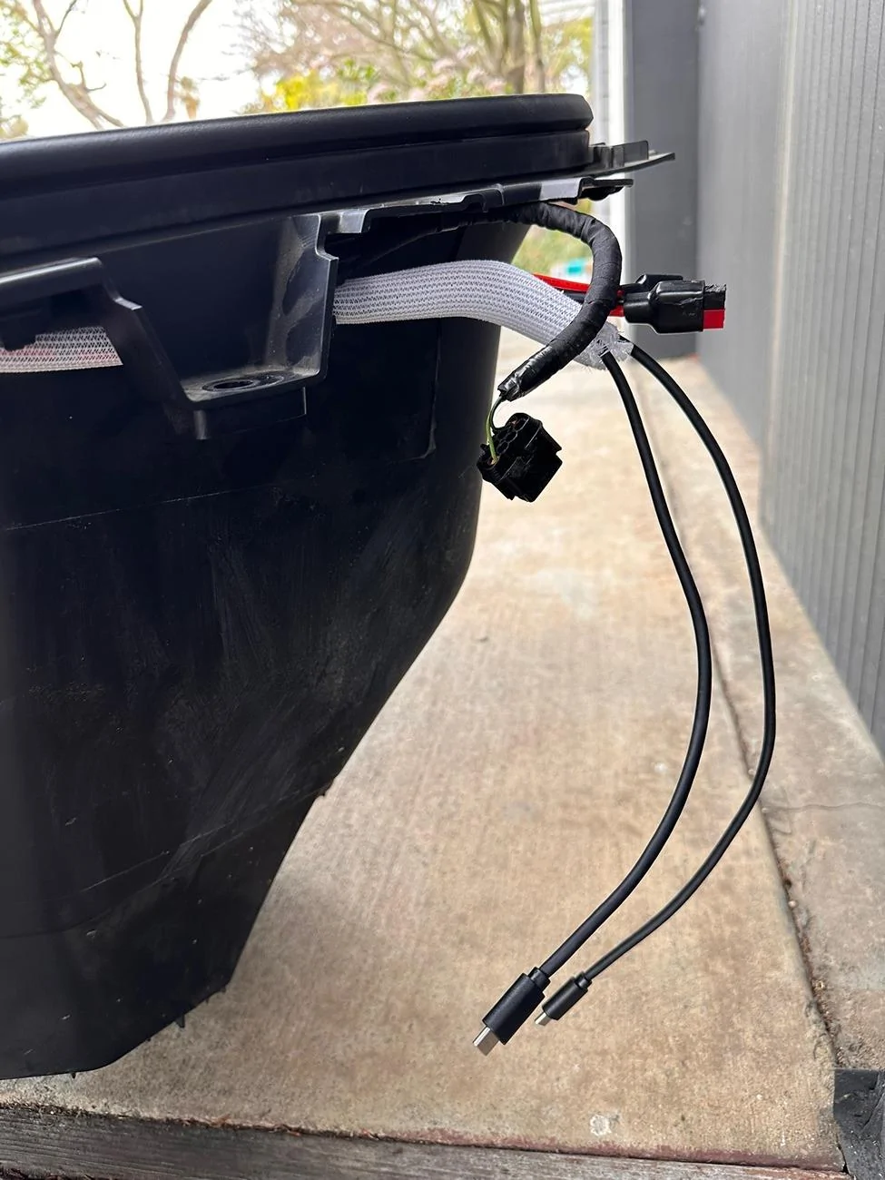 Rivian R1T R1S Installed frunk wired solar-capable 12v battery tender to reduce vampire drain IMG_4216