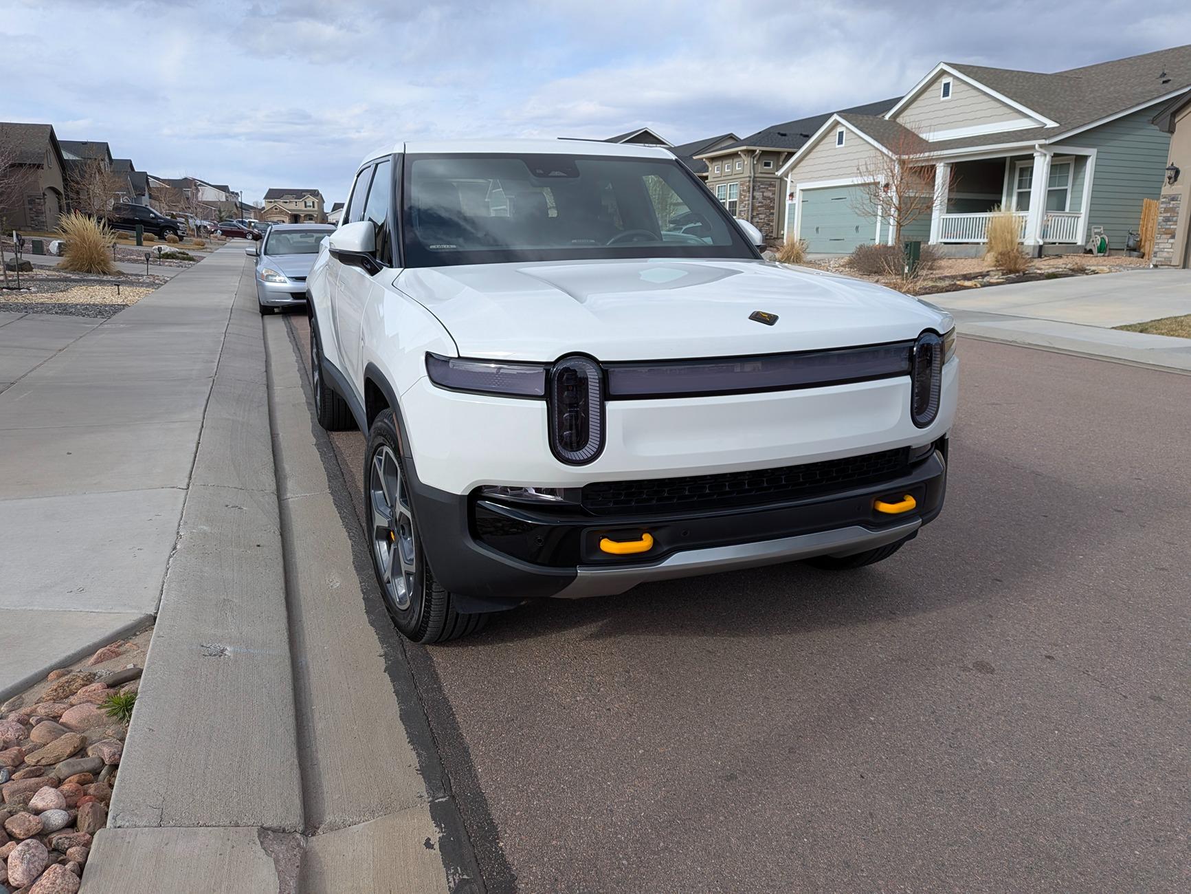 Rivian R1T R1S Installed abstract ocean emblems and twraps headlight tint PXL_20250408_230247311