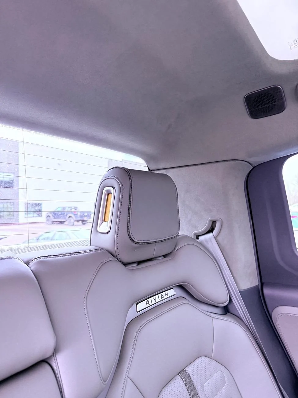 Rivian R1T R1S Dealer installed headrest backward - will it come back to normal? IMG_4956
