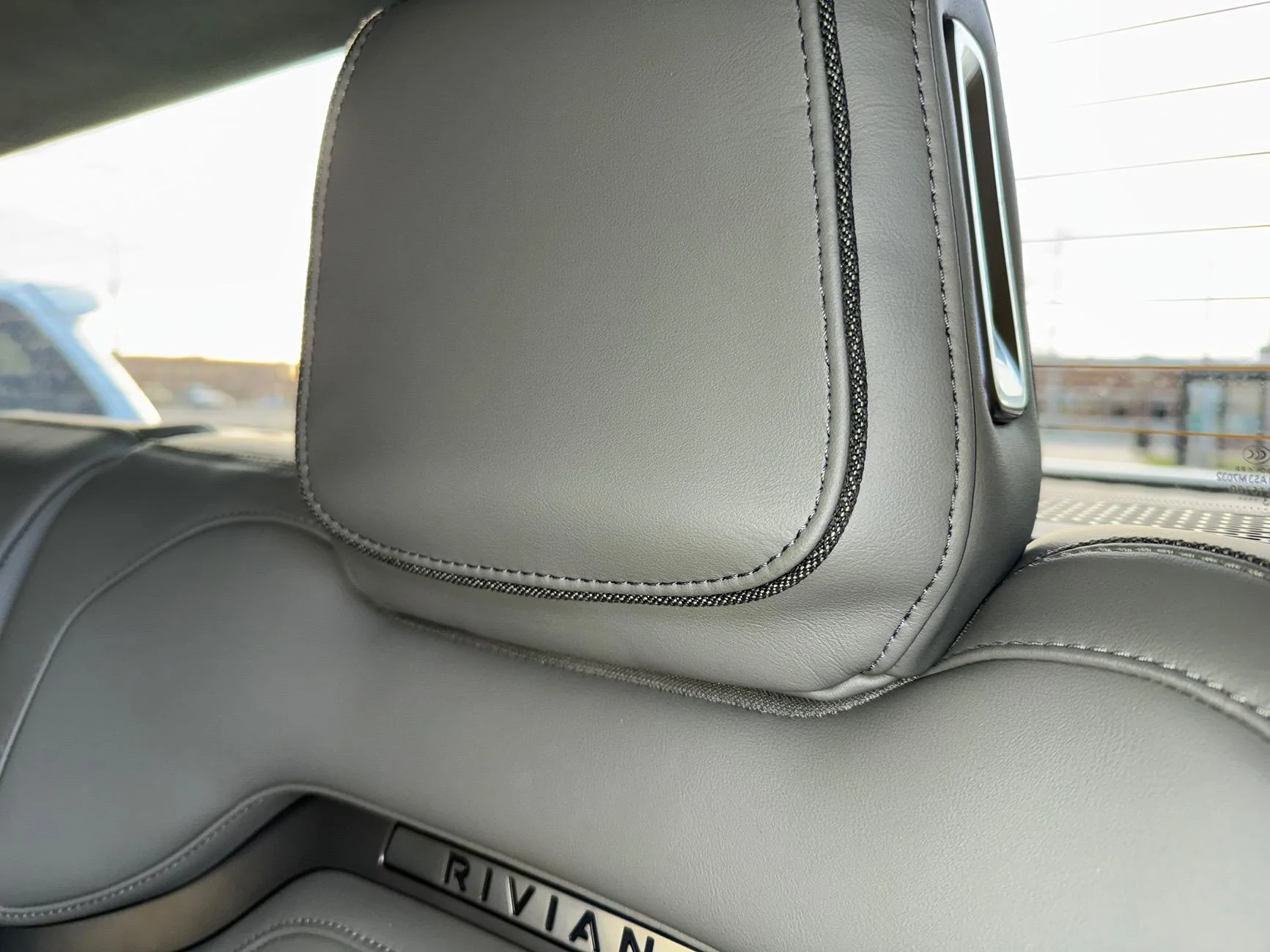 Rivian R1T R1S Dealer installed headrest backward - will it come back to normal? IMG_4987
