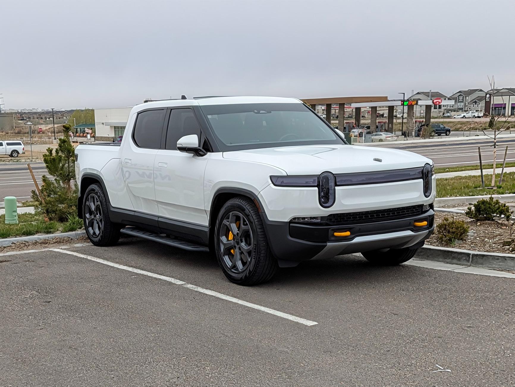Rivian R1T R1S EVBASE R1S running boards installed on R1T PXL_20250429_141720966~2