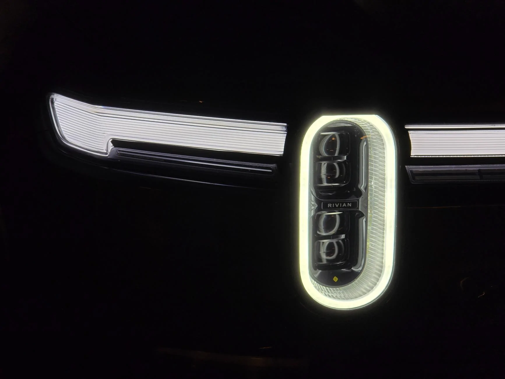 Rivian R1T R1S Front appearance improvement with vinyl on front light bar + side stripes! 54500544157_6511df0f16_o