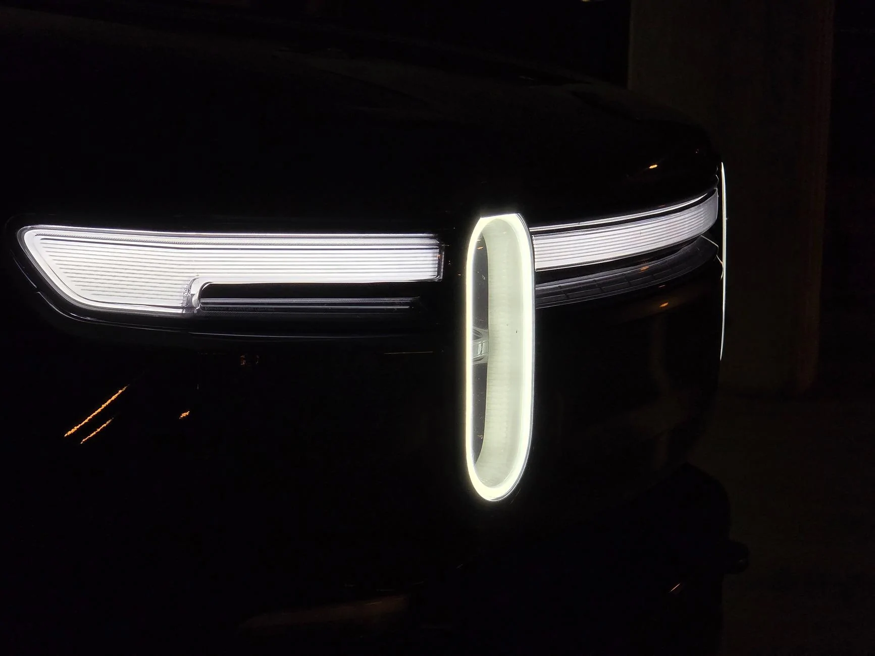 Rivian R1T R1S Front appearance improvement with vinyl on front light bar + side stripes! 54501406396_df47e64035_o