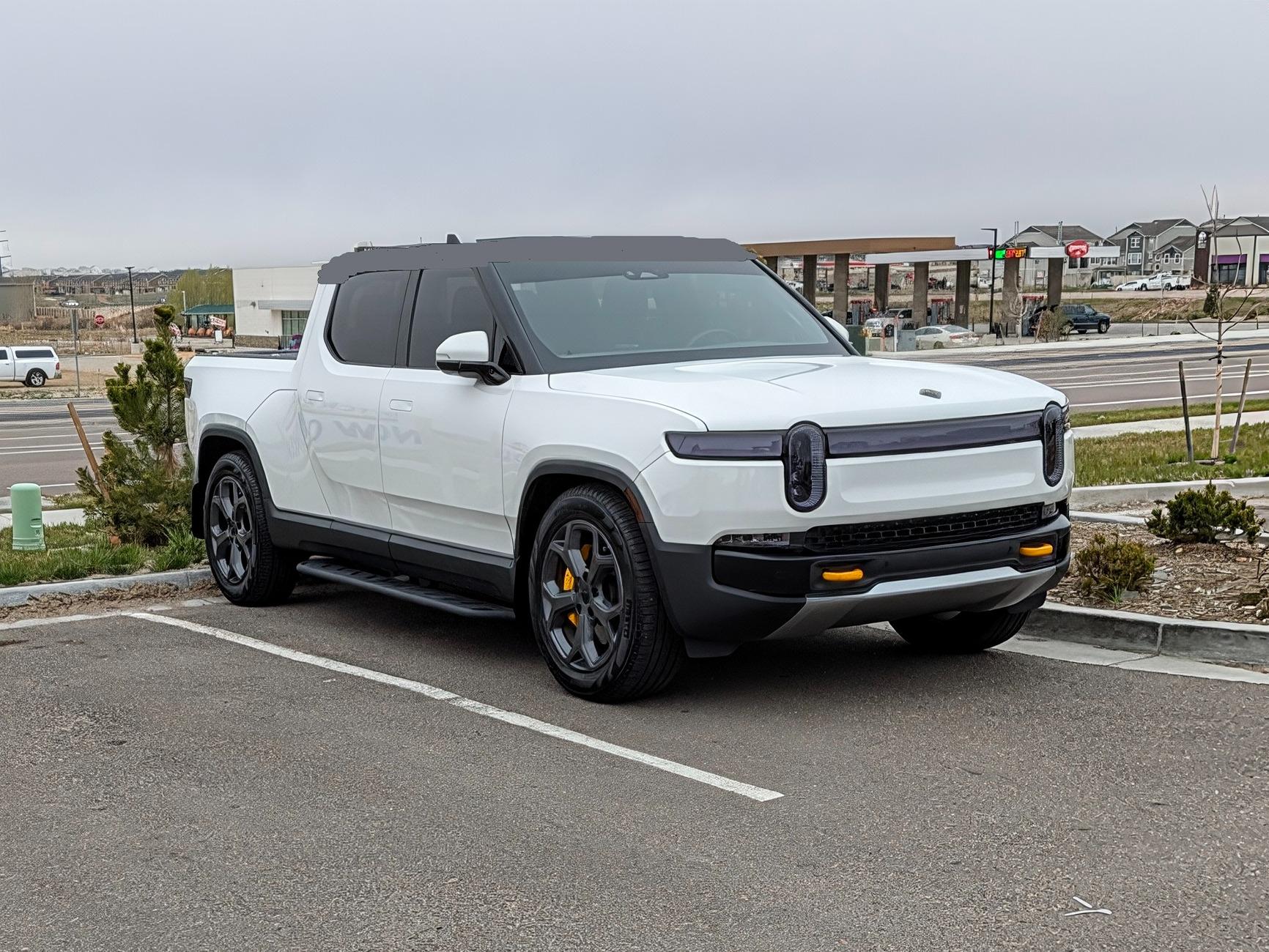 Rivian R1T R1S Front appearance improvement with vinyl on front light bar + side stripes! PXL_20250429_141720966~2