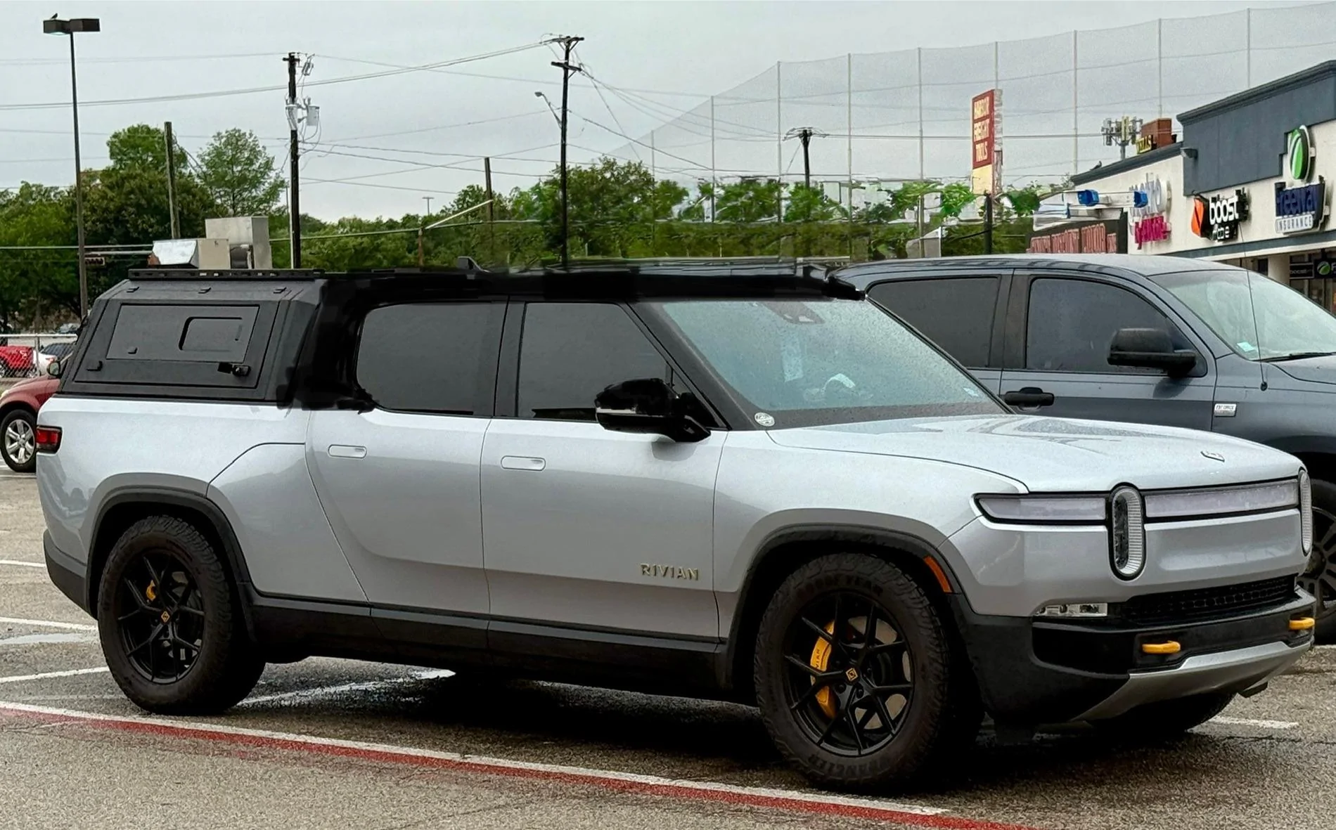 Rivian R1T R1S Front appearance improvement with vinyl on front light bar + side stripes! IMG_4479 2