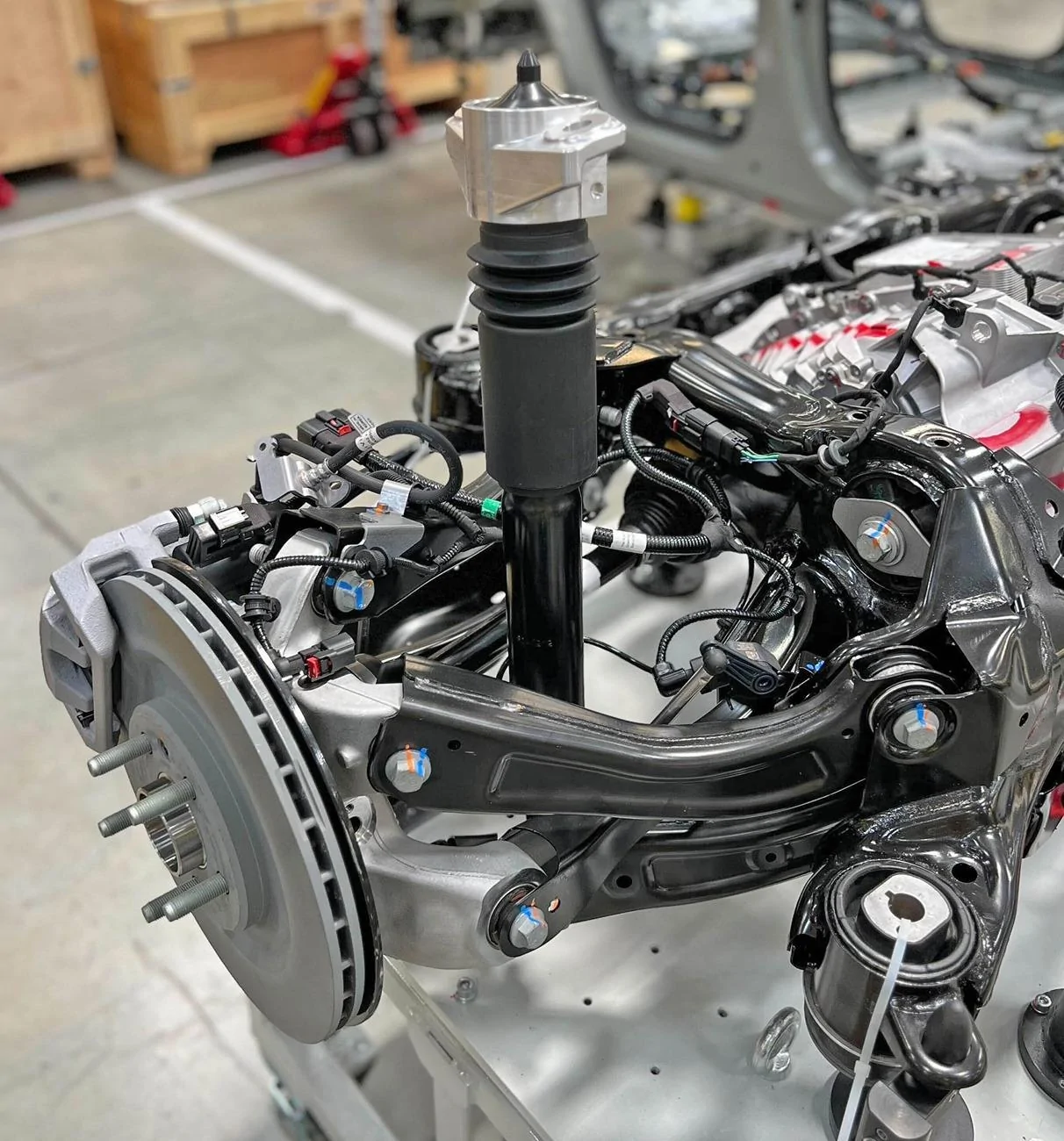 Rivian R1T R1S R2 rear suspension has "incredible ride quality and handling" says RJ Scaring with preview photos rivian r2 rear suspension 2