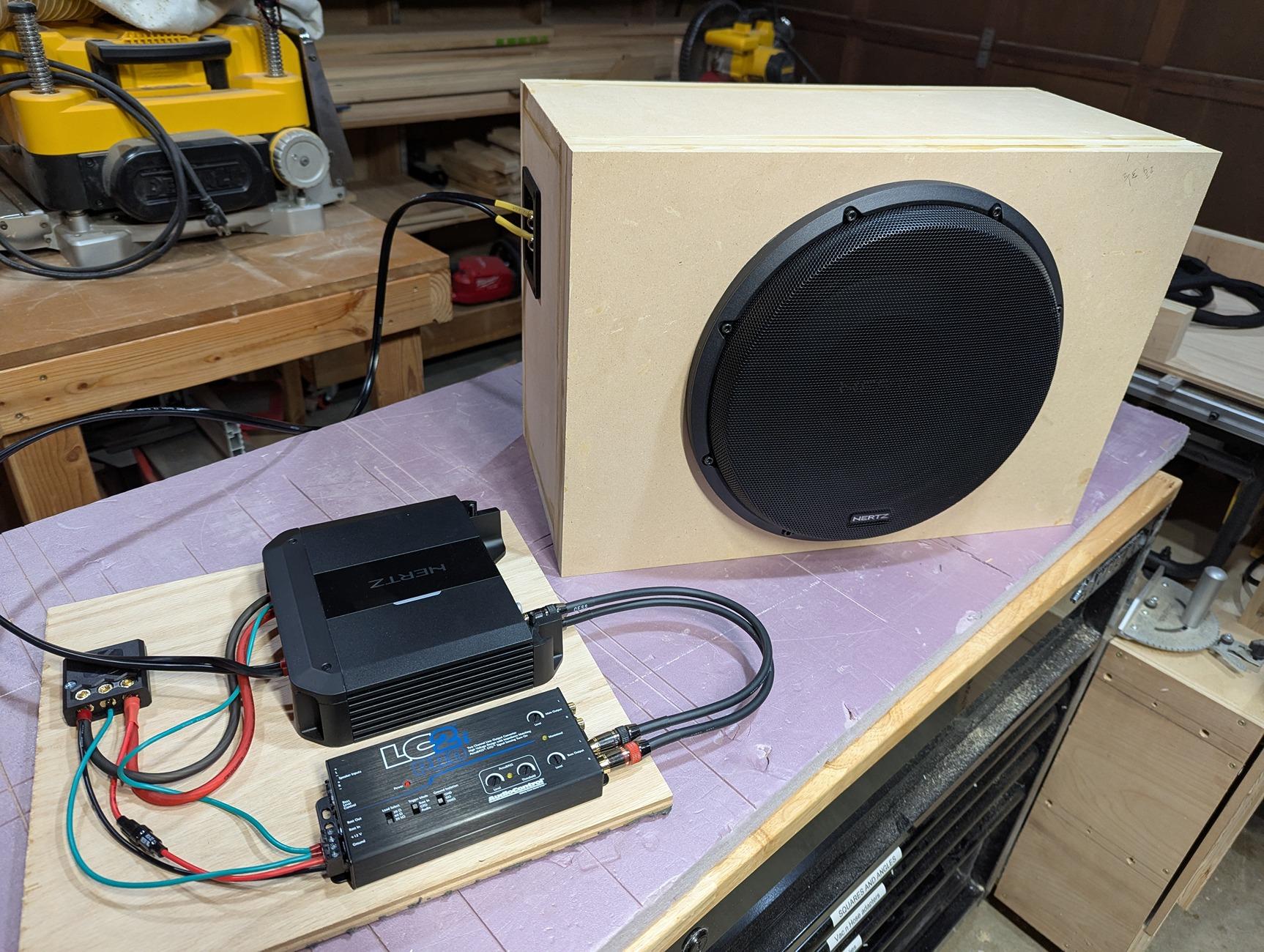 Rivian R1T R1S Gen 1 R1T aftermarket subwoofer box install in gear tunnel sub (3)