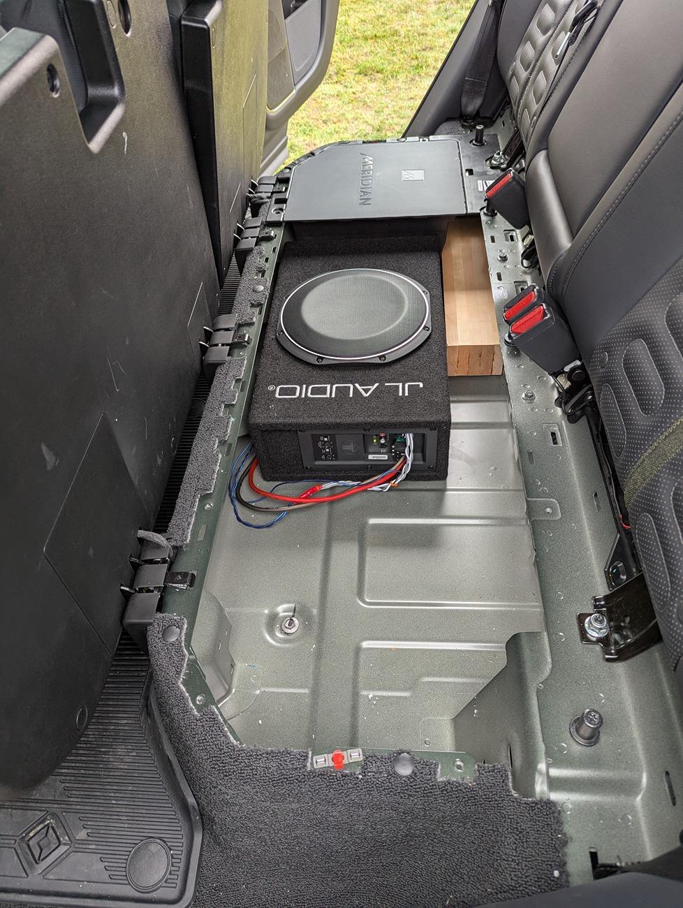 Rivian R1T R1S Gen 1 R1T aftermarket subwoofer box install in gear tunnel sub (1)