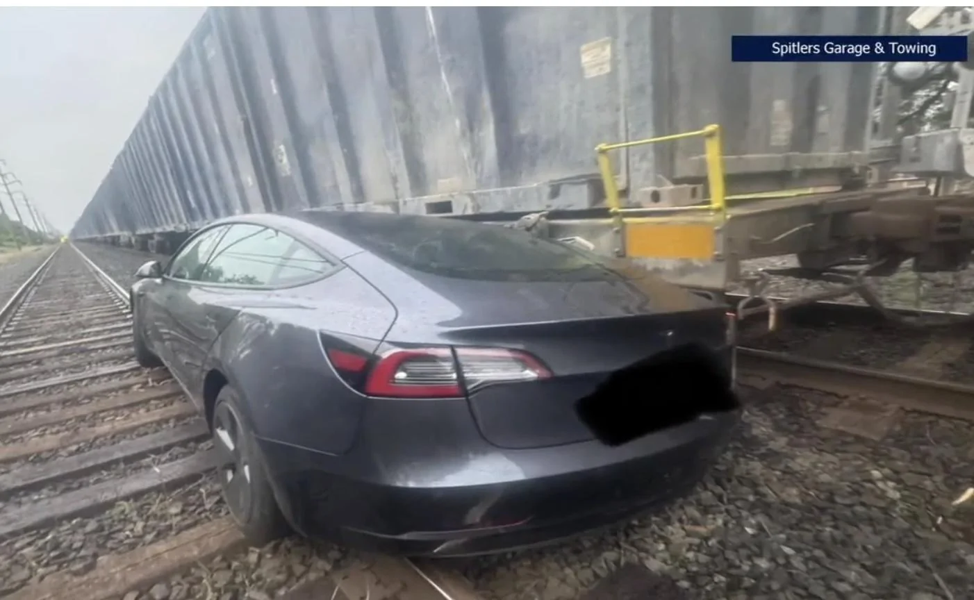 Rivian R1T R1S Tesla FSD drives down railroad tracks, gets hit by train DF903DF4-87FB-4C32-B6BE-03850D0C246F