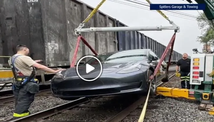 Rivian R1T R1S Tesla FSD drives down railroad tracks, gets hit by train 1750080775622-n7