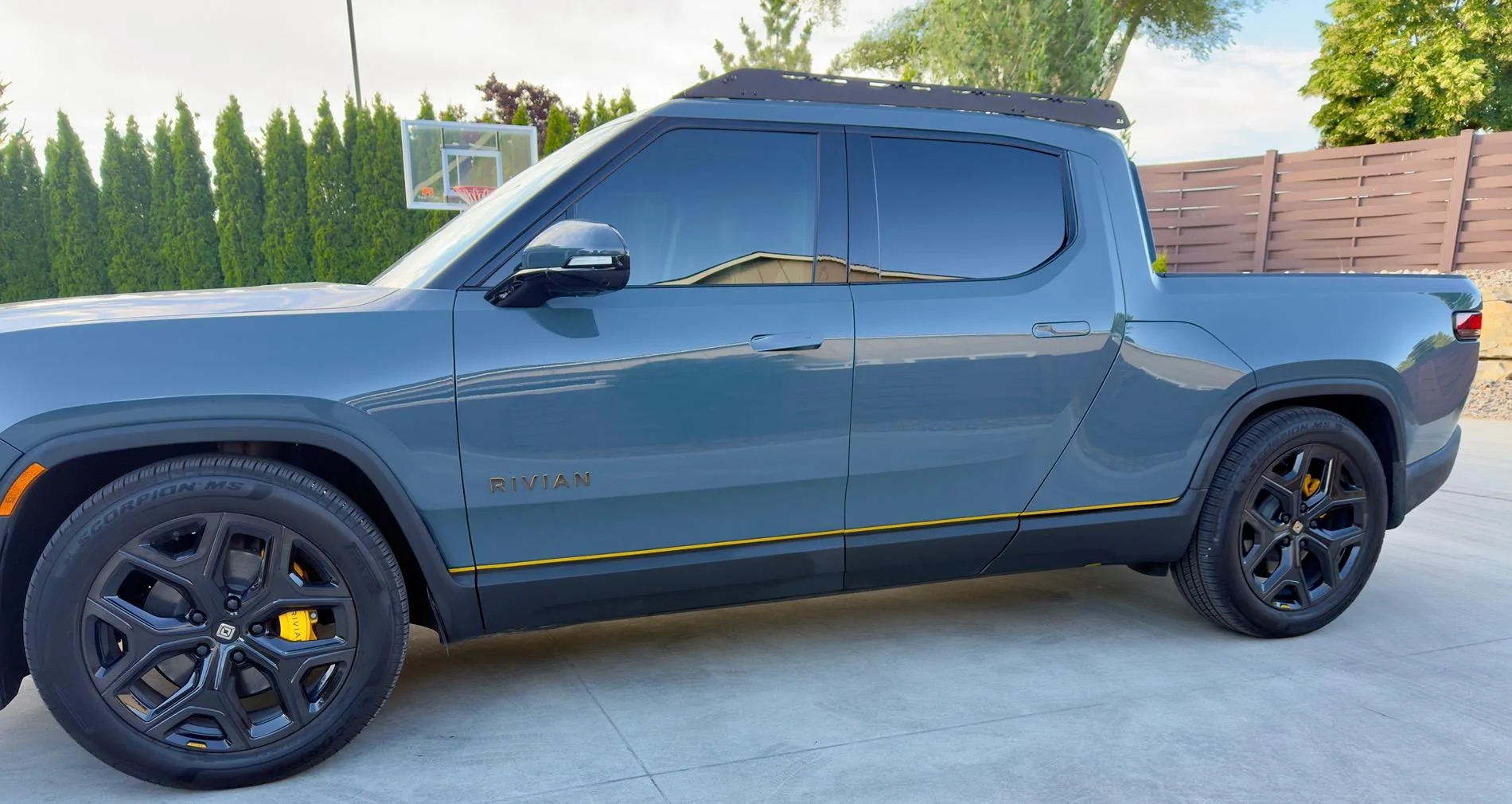 Rivian R1T R1S Front appearance improvement with vinyl on front light bar + side stripes! IMG_2012