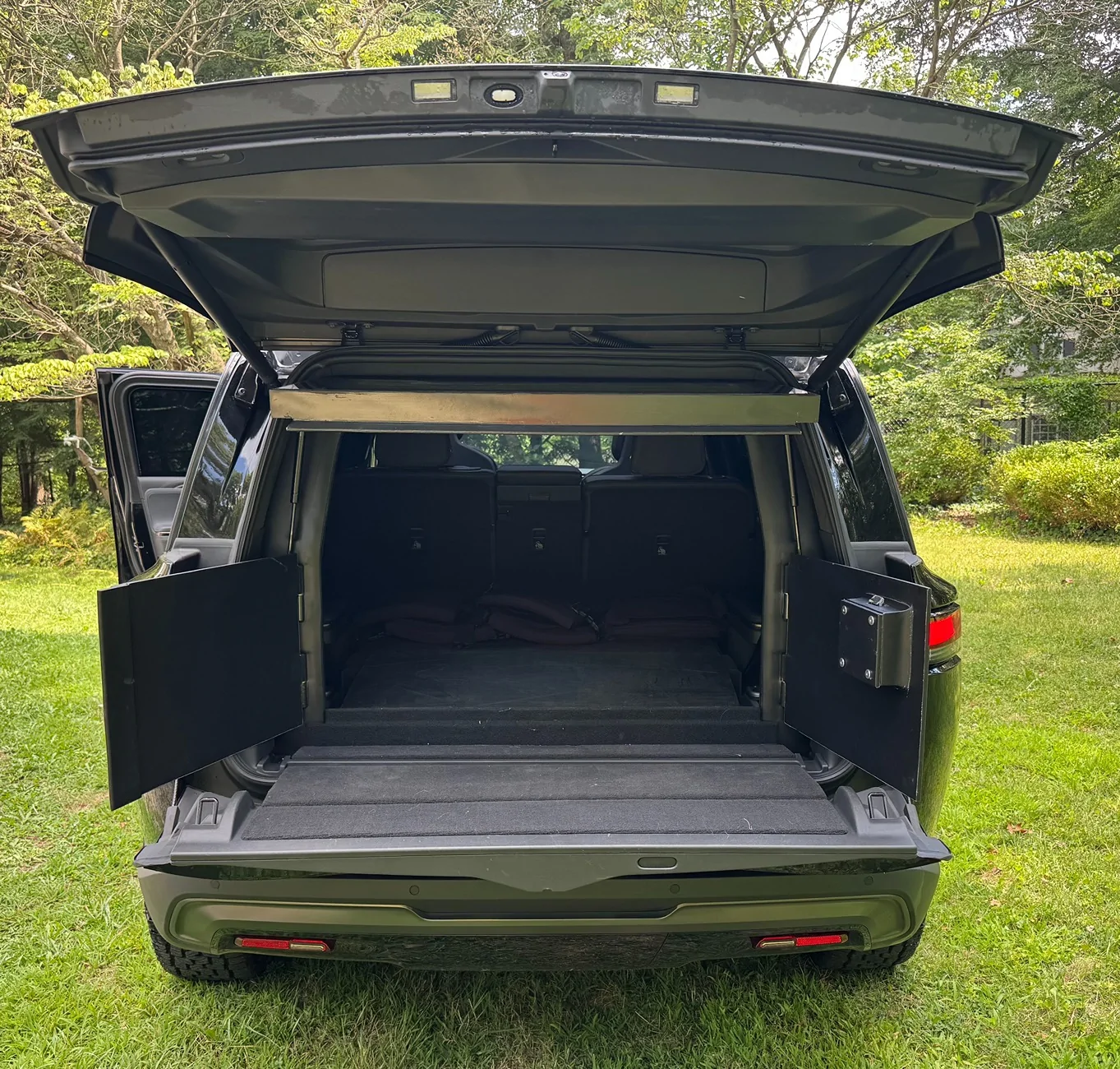 Rivian R1T R1S Did someone say Armor? Real Ballistic Armored (Bulletproof) R1S Tri Motor in production process... R1S_Rear_Door_Open