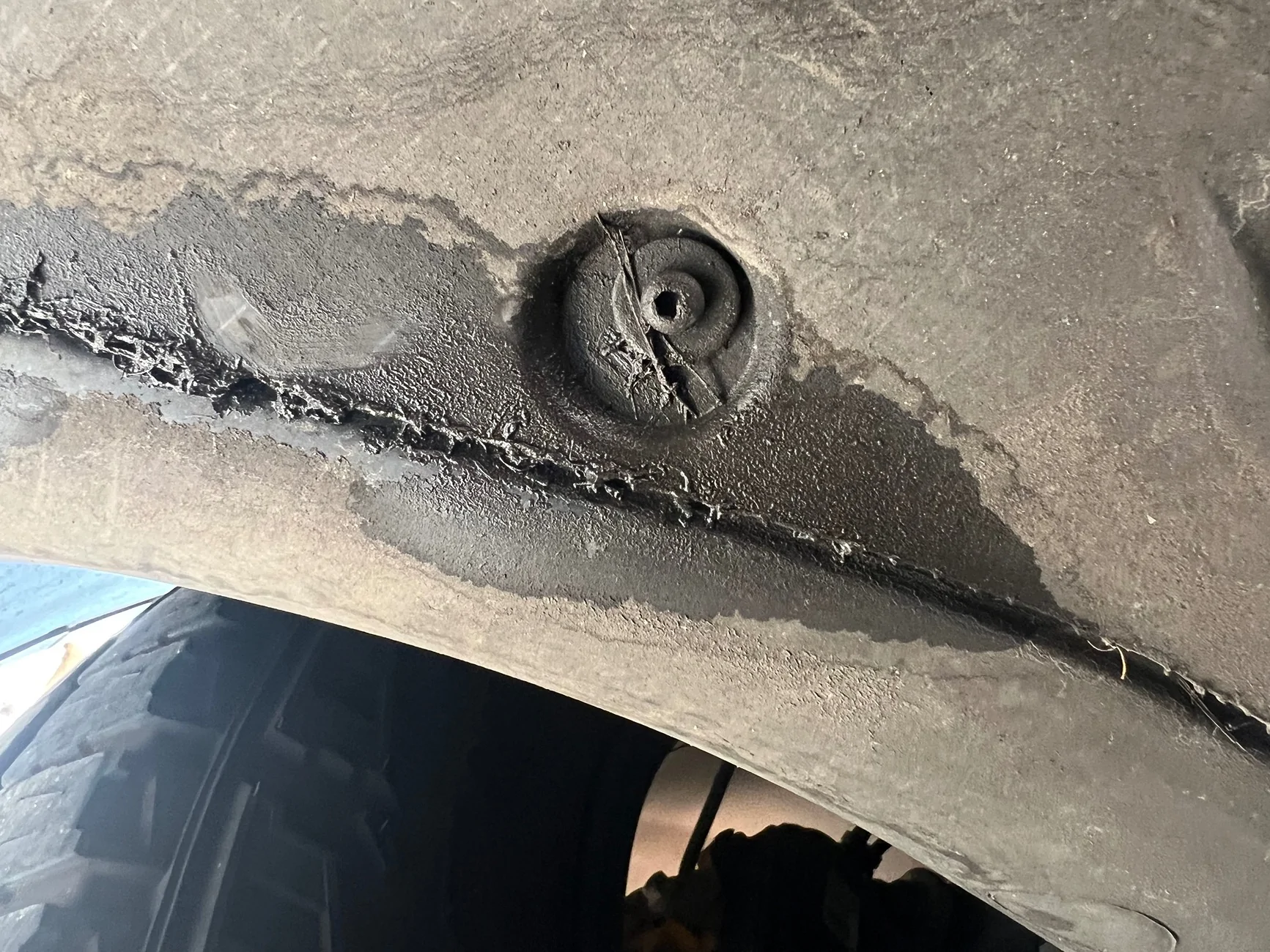 Rivian R1T R1S Fluid leak at rear drivers side - oily substance IMG_3945