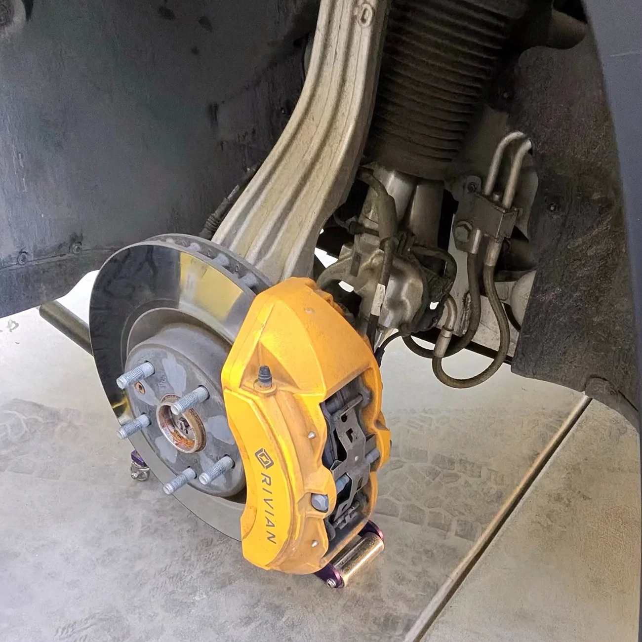 Rivian R1T R1S Cleaning yellow calipers 1759419937740-cj