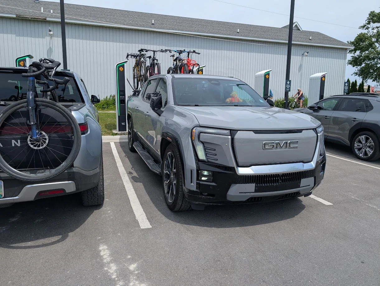 Rivian R1T R1S R2 spotted charging via NACS port at Tesla Supercharger 1760970147492-j