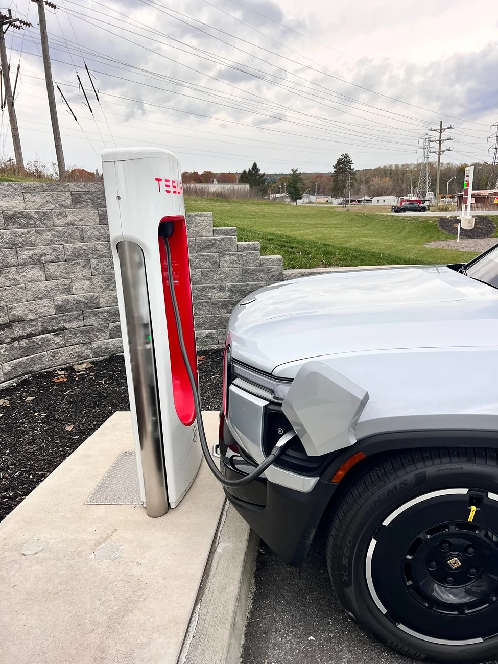 Rivian R1T R1S Tesla supercharger question: blocking a stall due to short cable IMG_8250