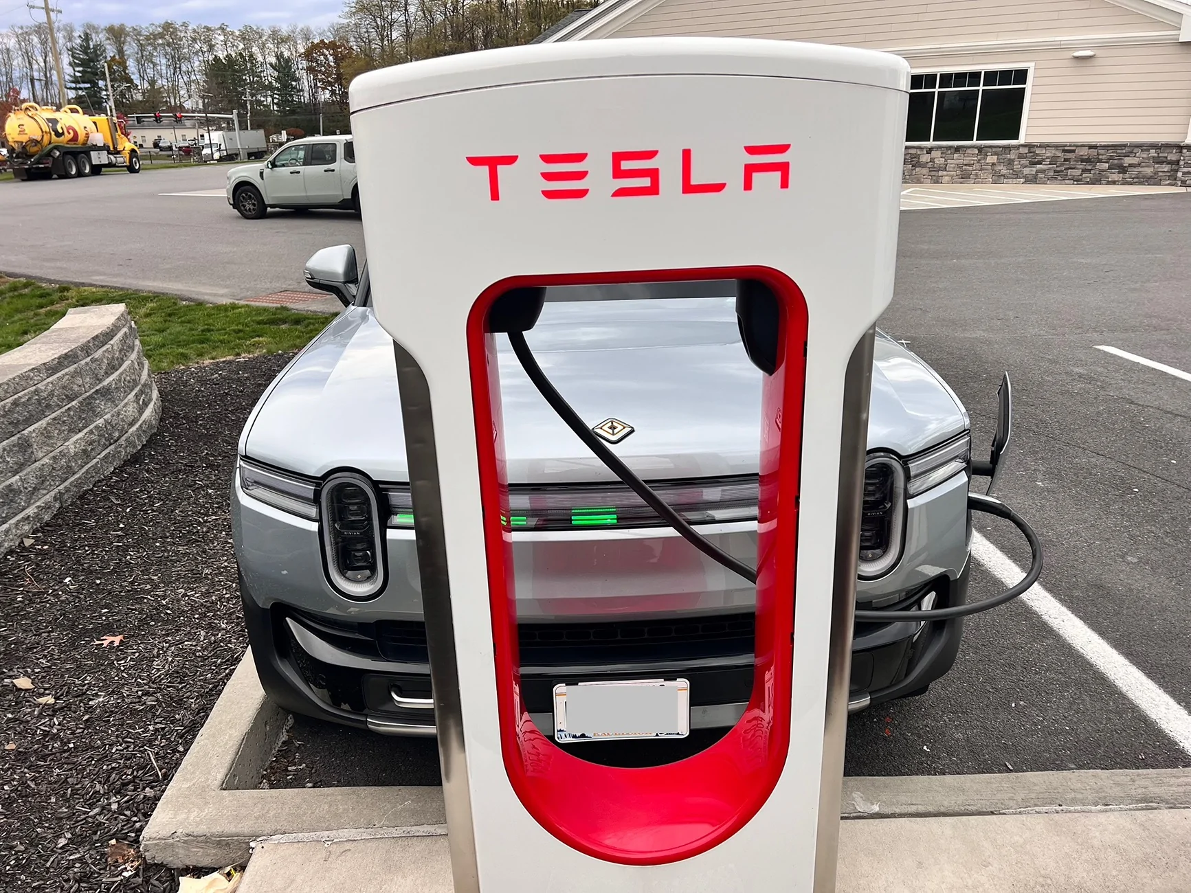 Rivian R1T R1S Tesla supercharger question: blocking a stall due to short cable IMG_8252