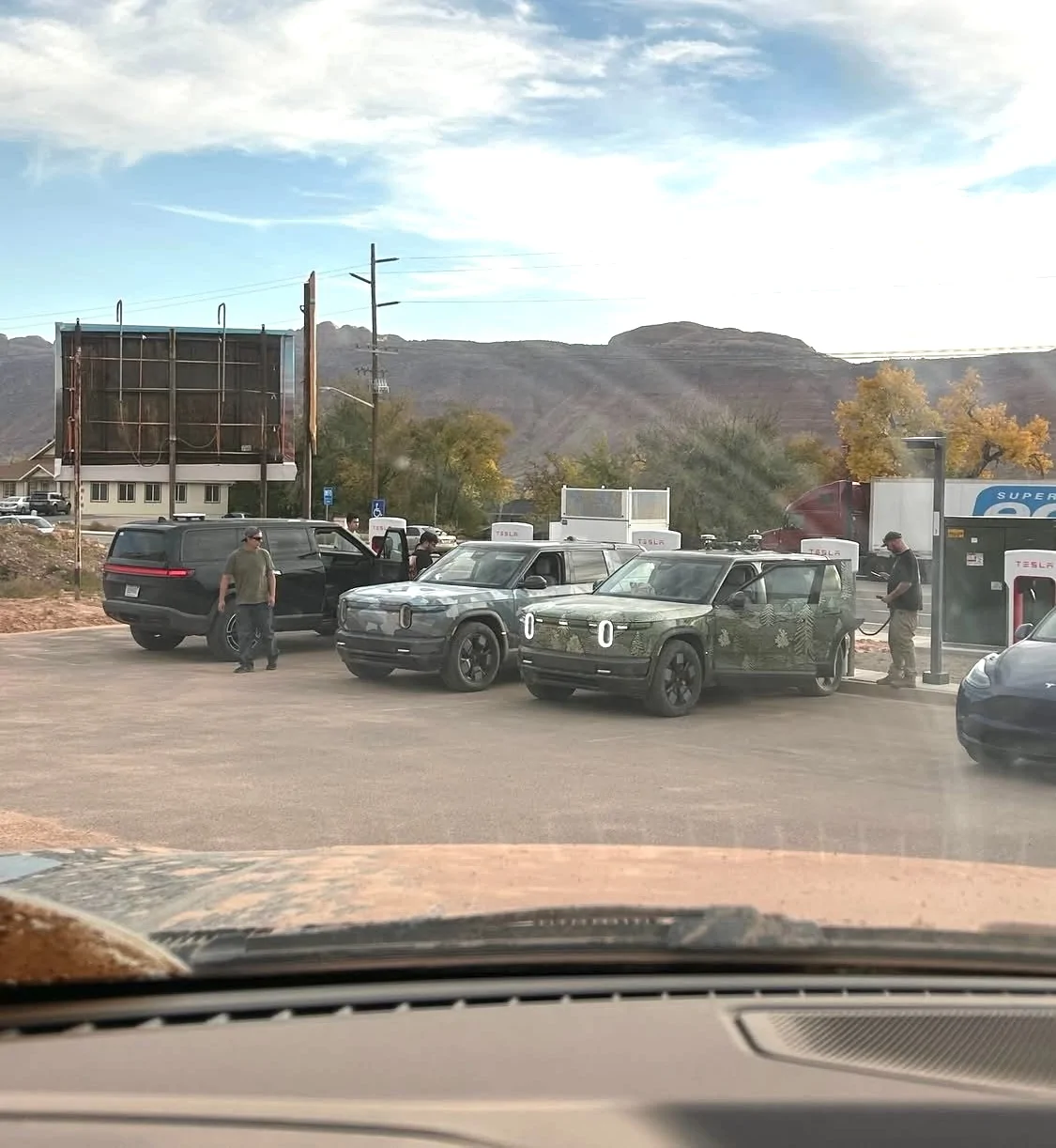 Rivian R1T R1S R2 prototypes spotted in Moab, charging at Tesla supercharger G5CSUUYW0AAucs