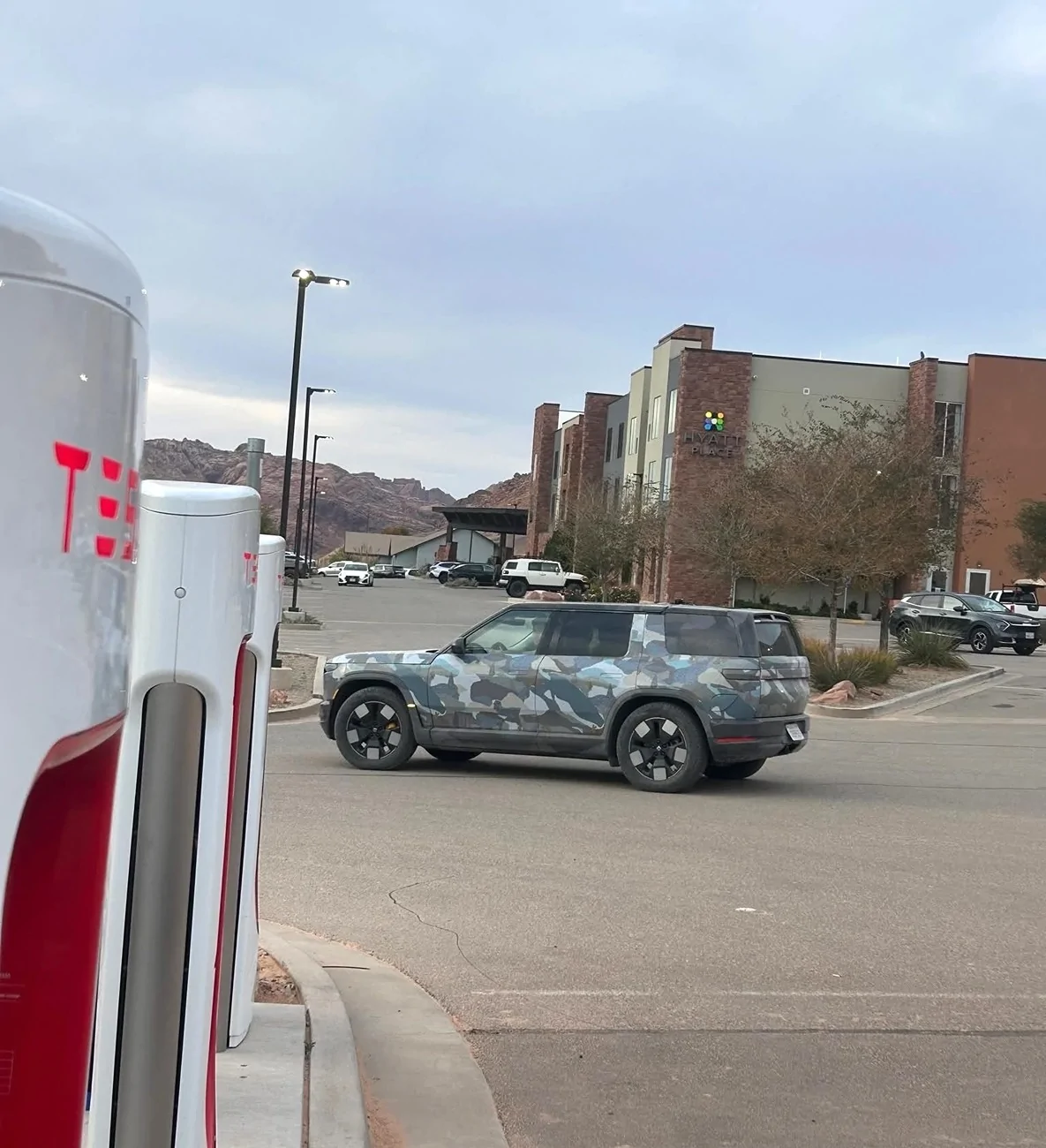Rivian R1T R1S R2 prototypes spotted in Moab, charging at Tesla supercharger G5CSUPzWwAA-p3U