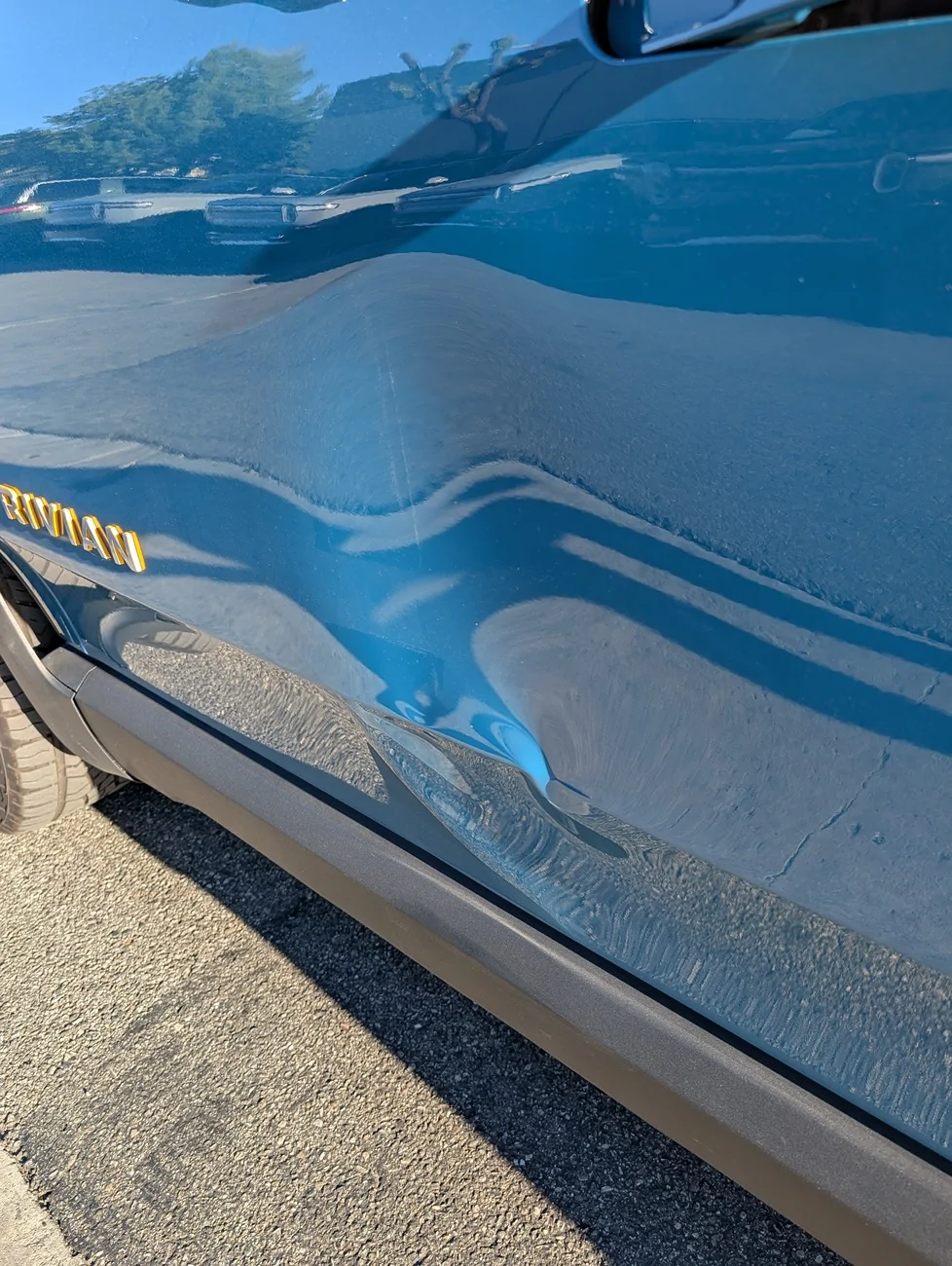 Rivian R1T R1S R1T Damaged at Costa Mesa service center (by a tech) PXL_20251209_225910560