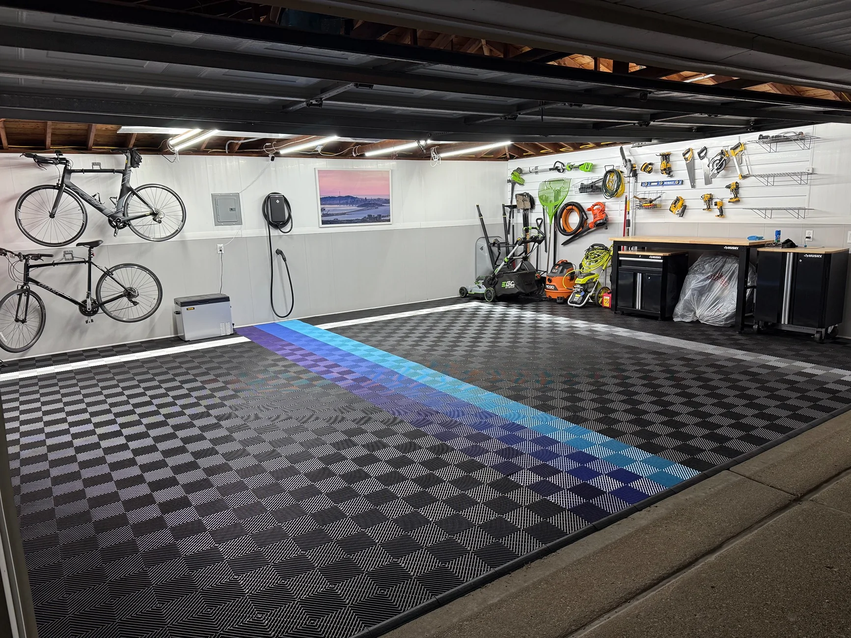 Rivian R1T R1S Anyone using garage tiles under their heavy Rivian? right sid